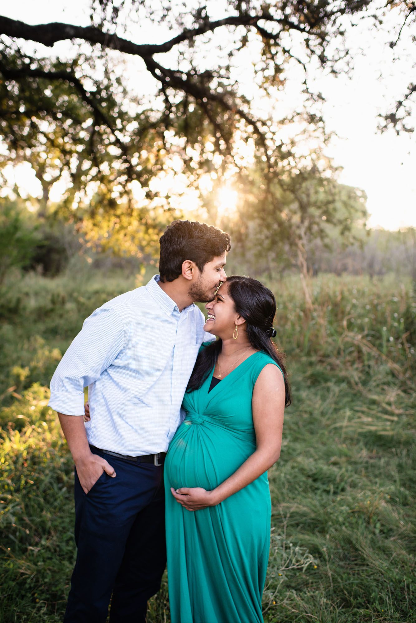 Pregnant couple laughing and kissing, San Antonio Lifestyle Maternity Photography