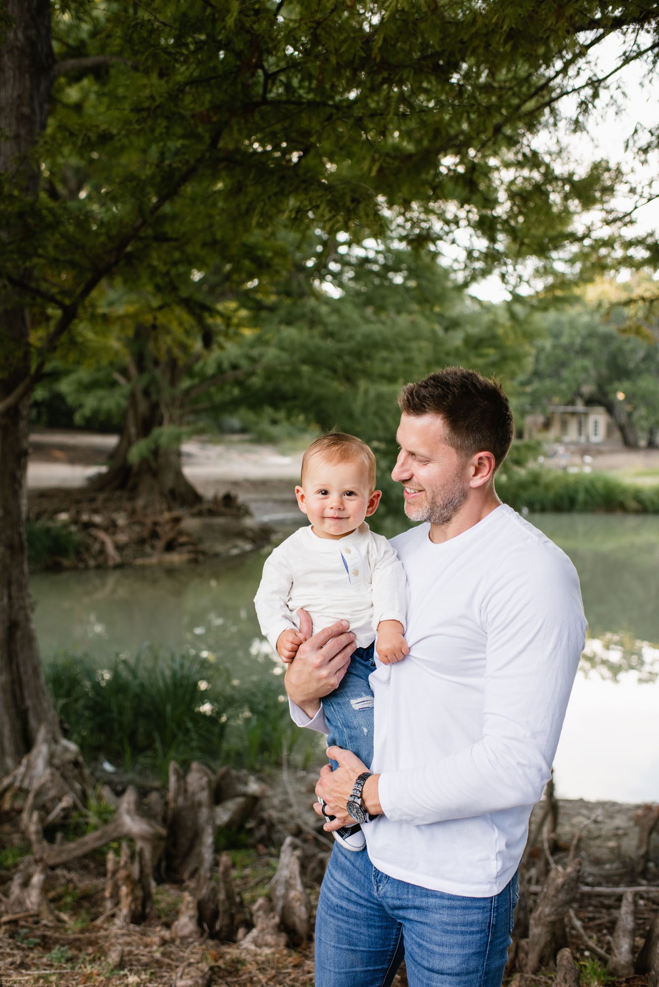 Father smiling at baby boy, Best Family photographer in San Antonio
