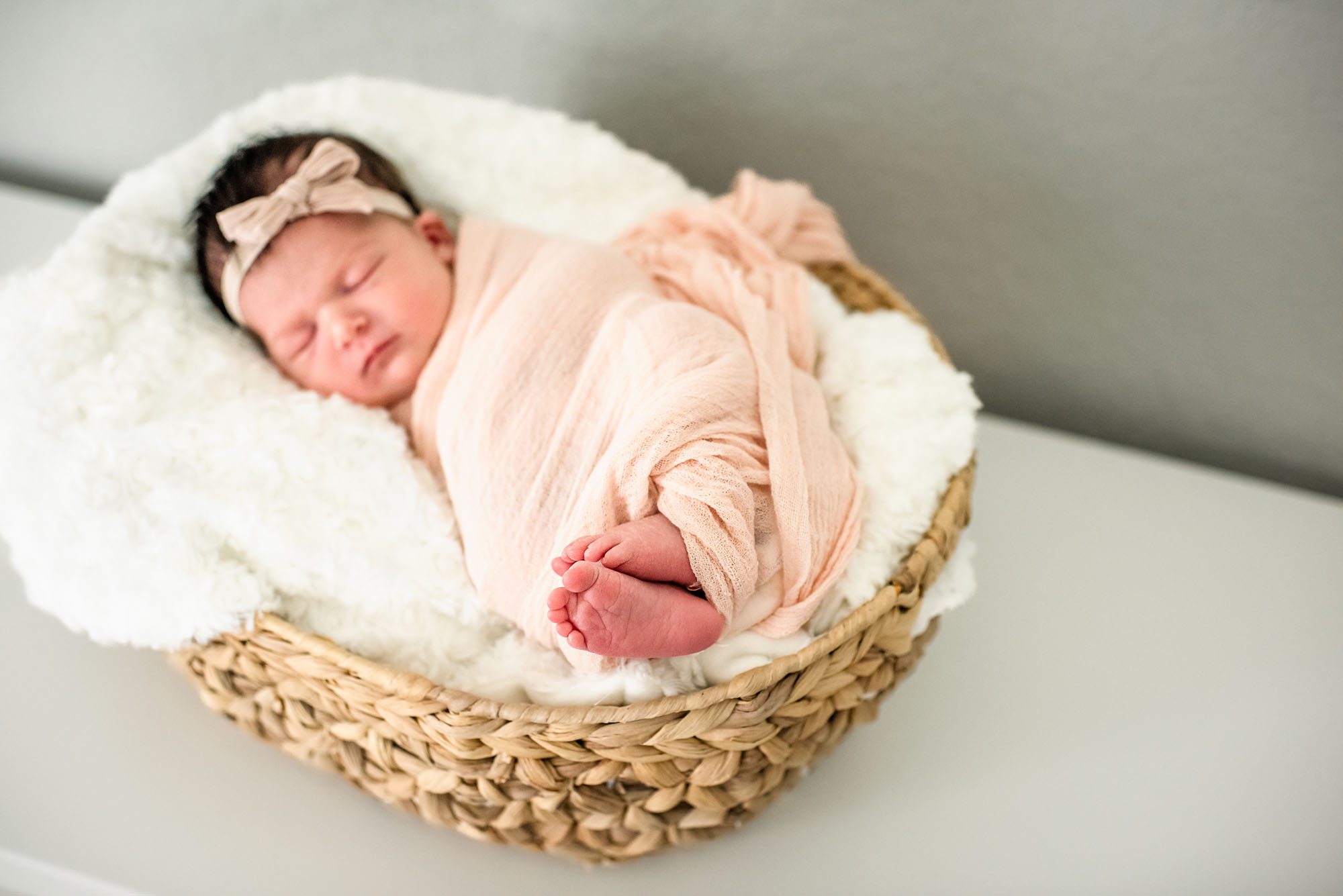 Newborn baby asleep in basket, San Antonio Newborn Photographer