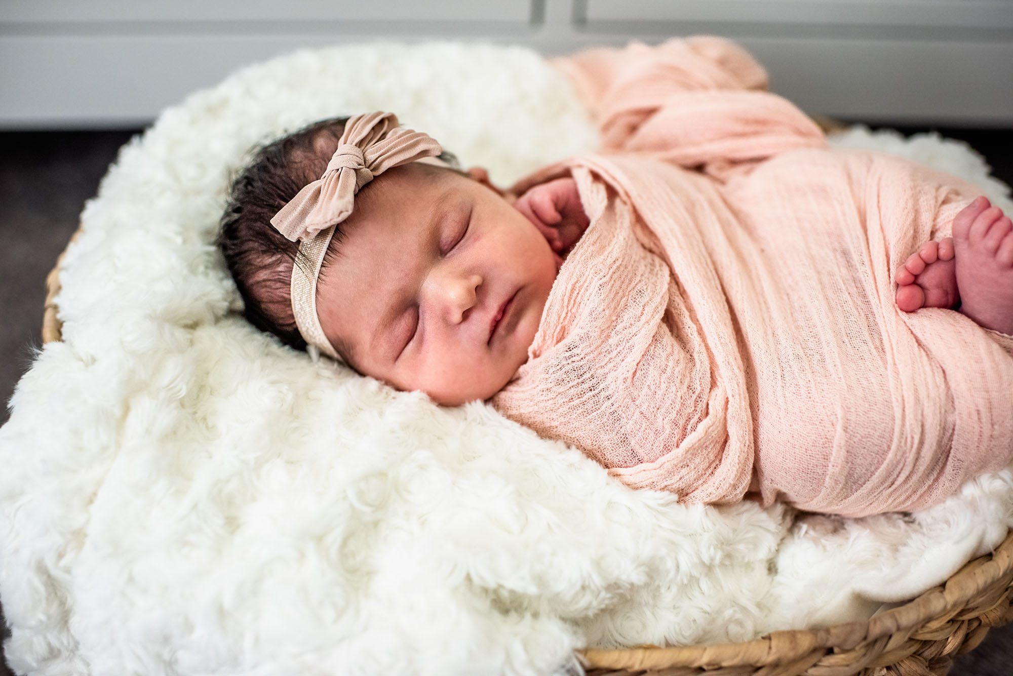 Newborn girl asleep in basket, San Antonio area Newborn Photographer