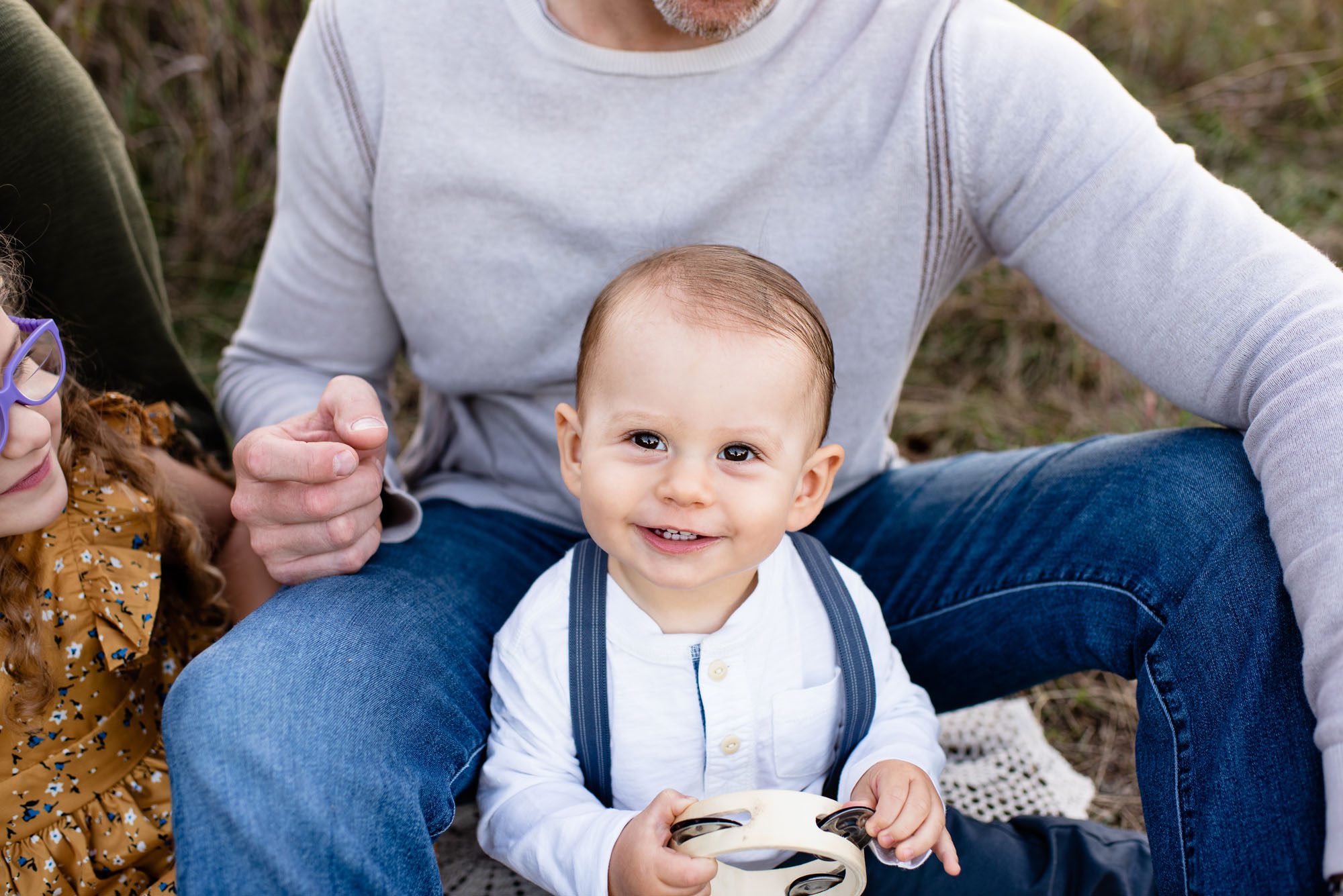 One year old boy smiling with tambourine, Best family photographer