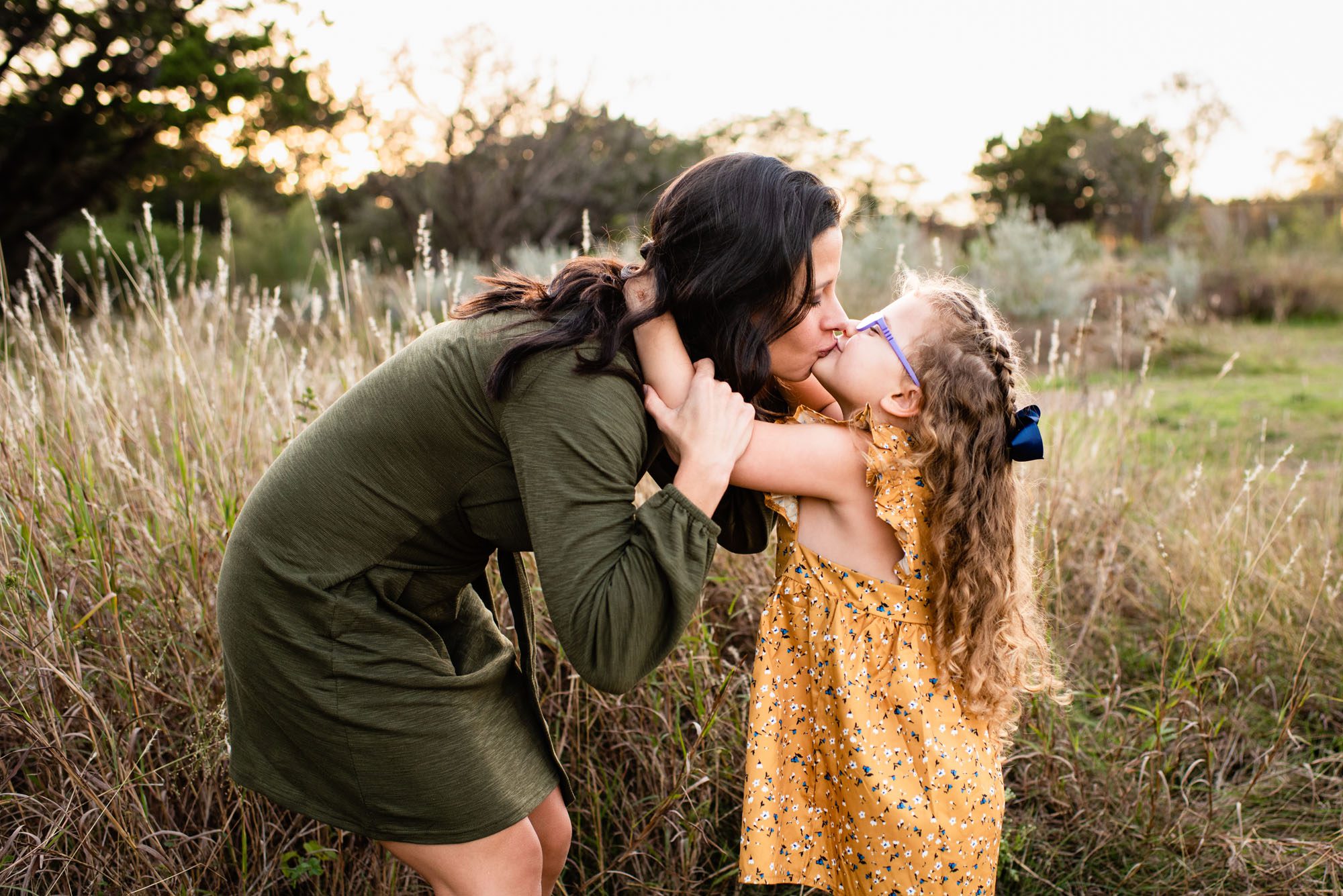 Daughter kissing mommy, San Antonio Family Photographer