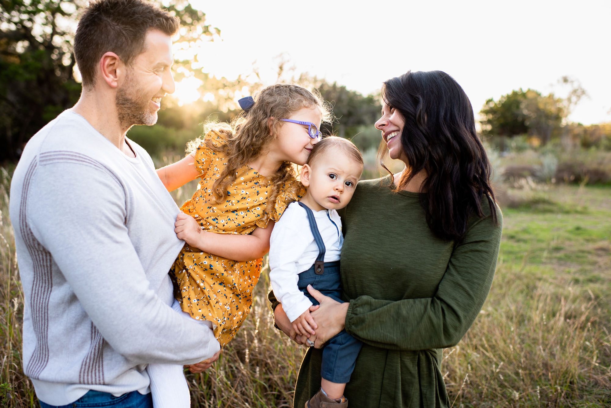 Family smiling at one another sunlight, San Antonio Lifestyle Family Photographer