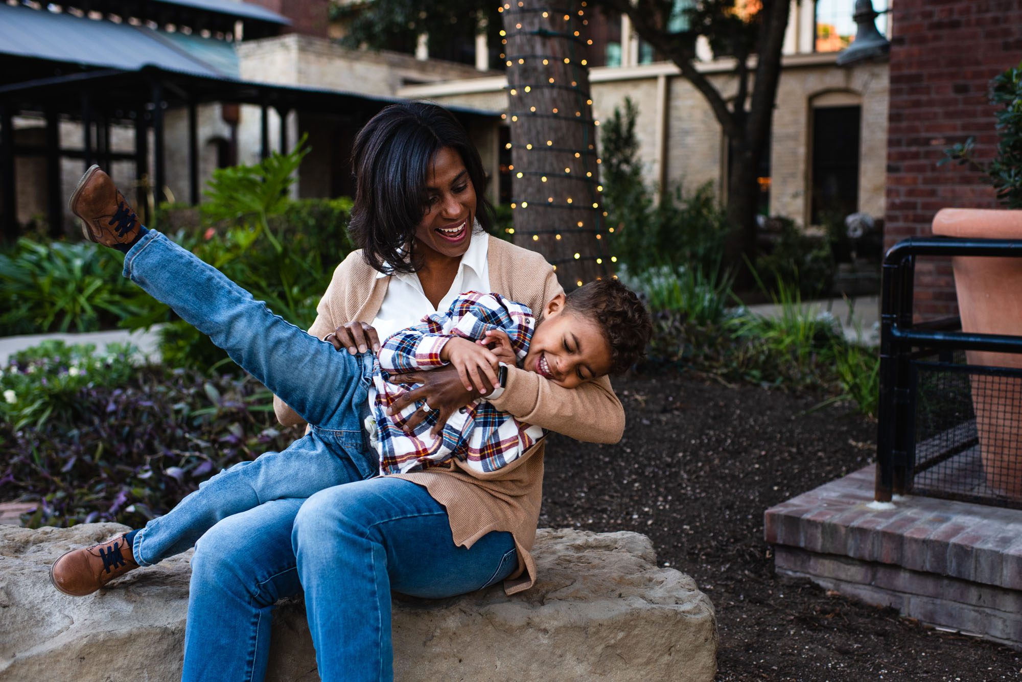 Mom tickling son on bench, Family Photographer San Antonio