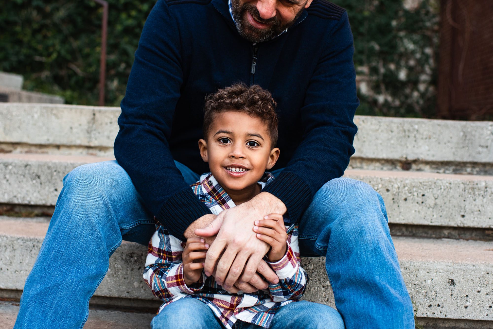 Father sitting on staircase with son, Family Photographer in San Antonio