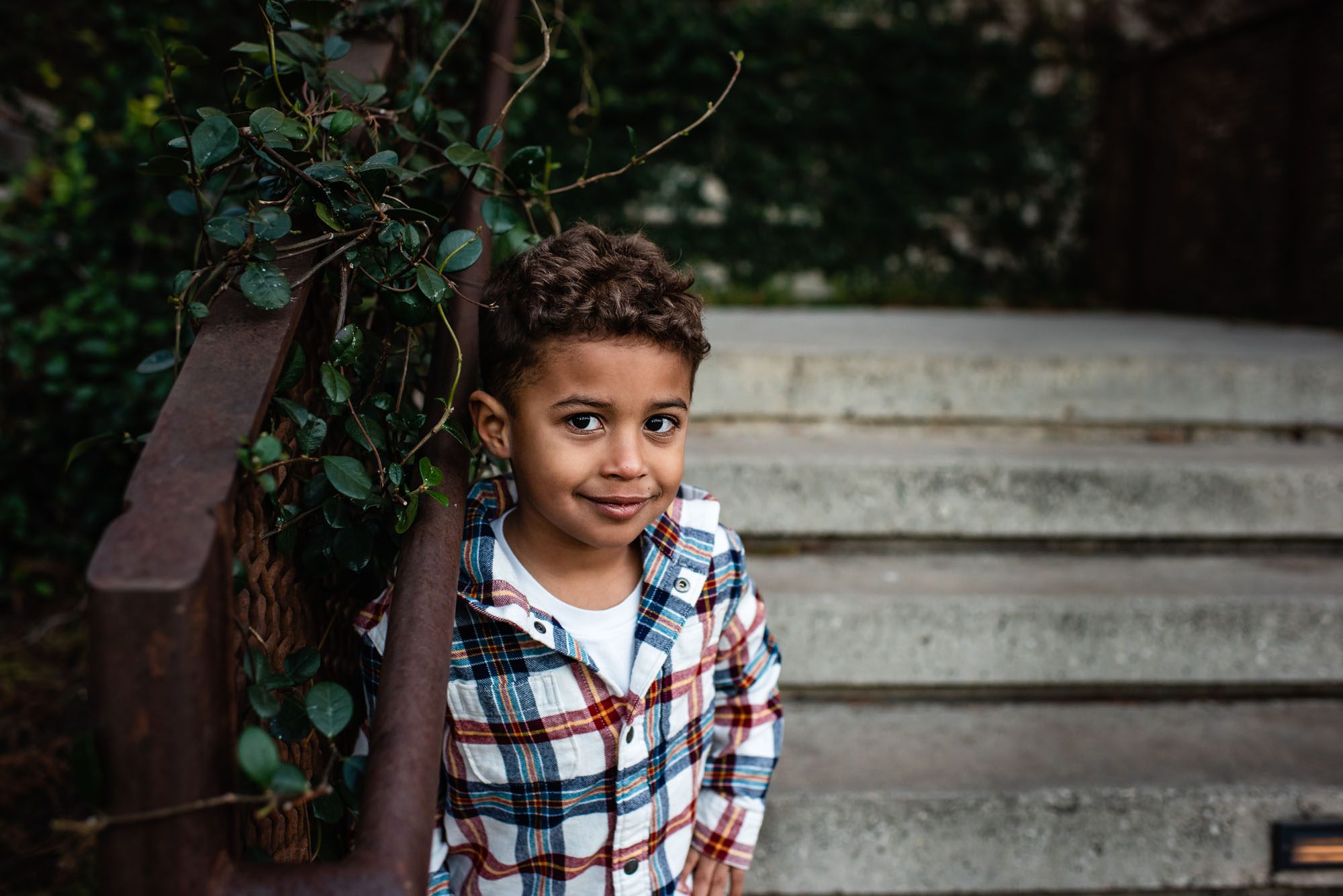 Boy standing by staircase, Best Child Photographer in San Antonio