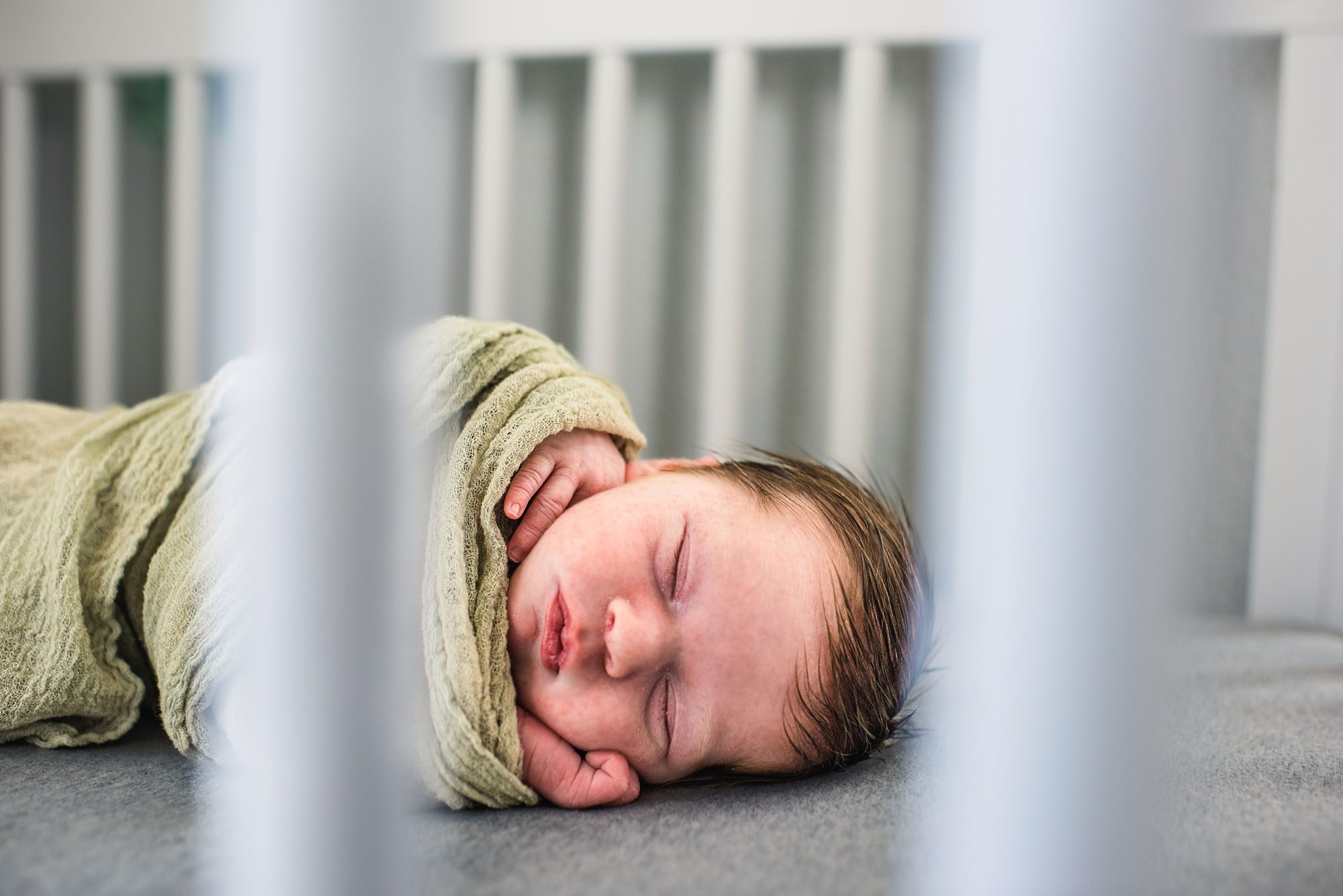 Close up of baby asleep in crib, San Antonio Newborn Photography