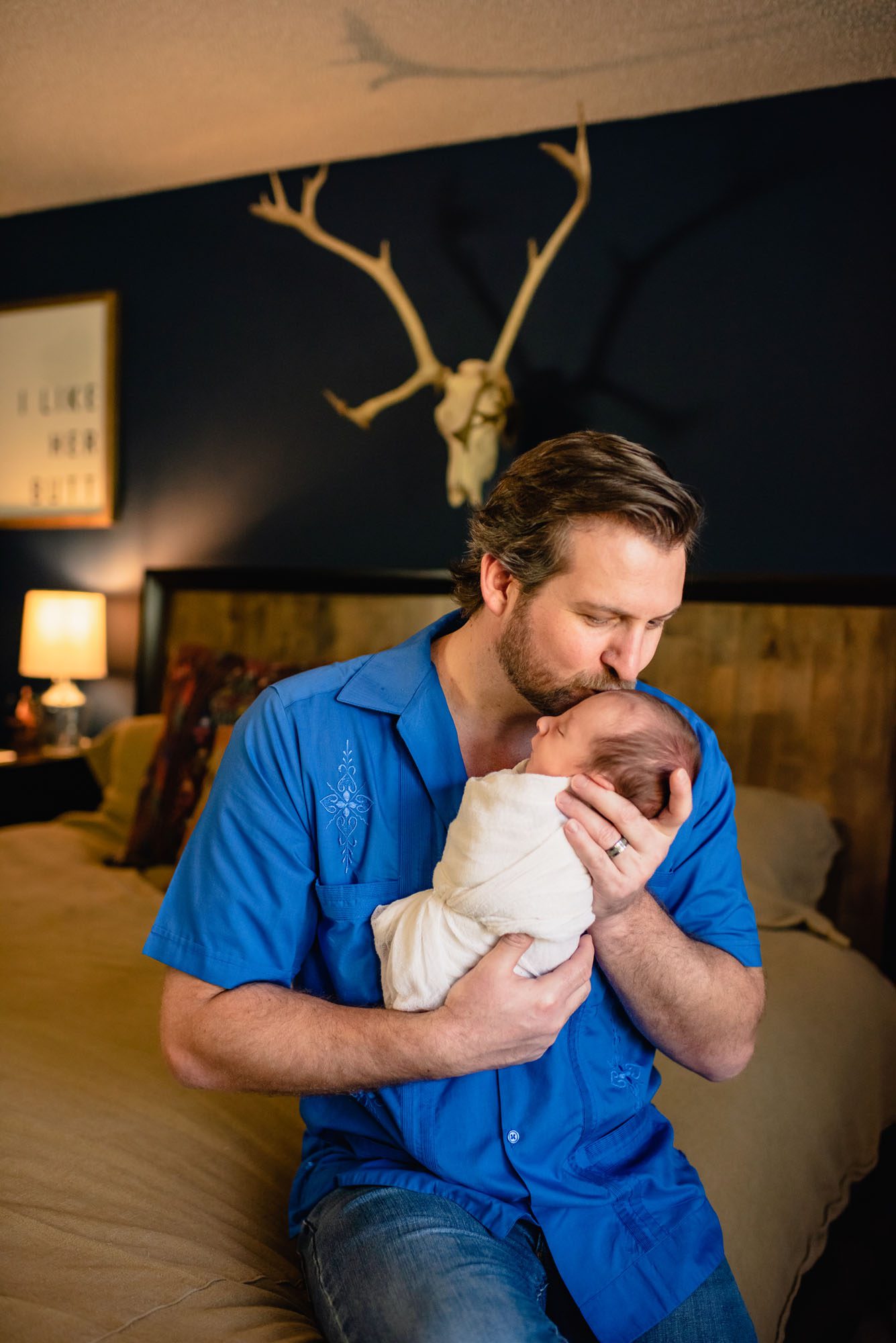 Dad kissing baby boy on his head, San Antonio Newborn Photographer