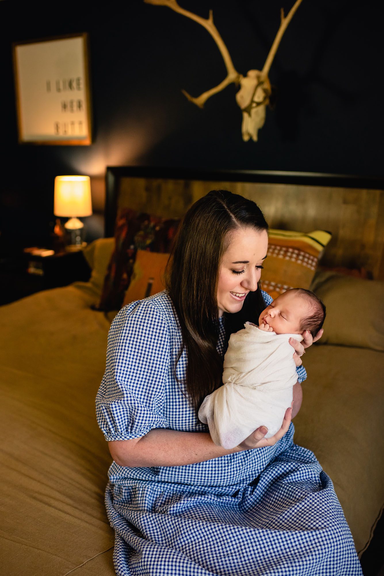 Mom holding baby in bedroom, San Antonio Newborn Photographer