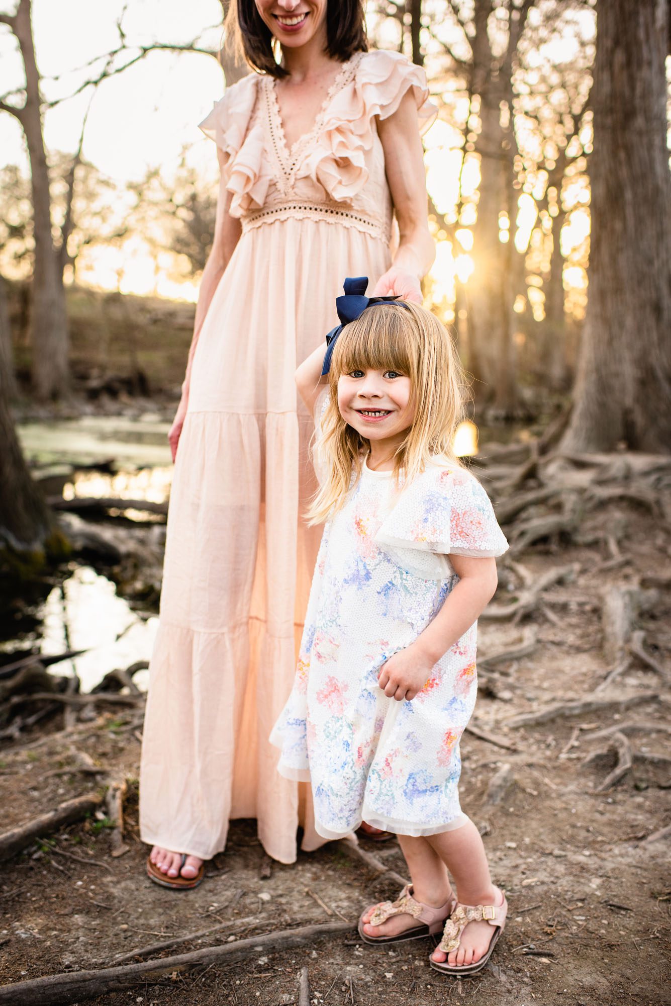 Daughter walking with mother by the river, San Antonio family photographer