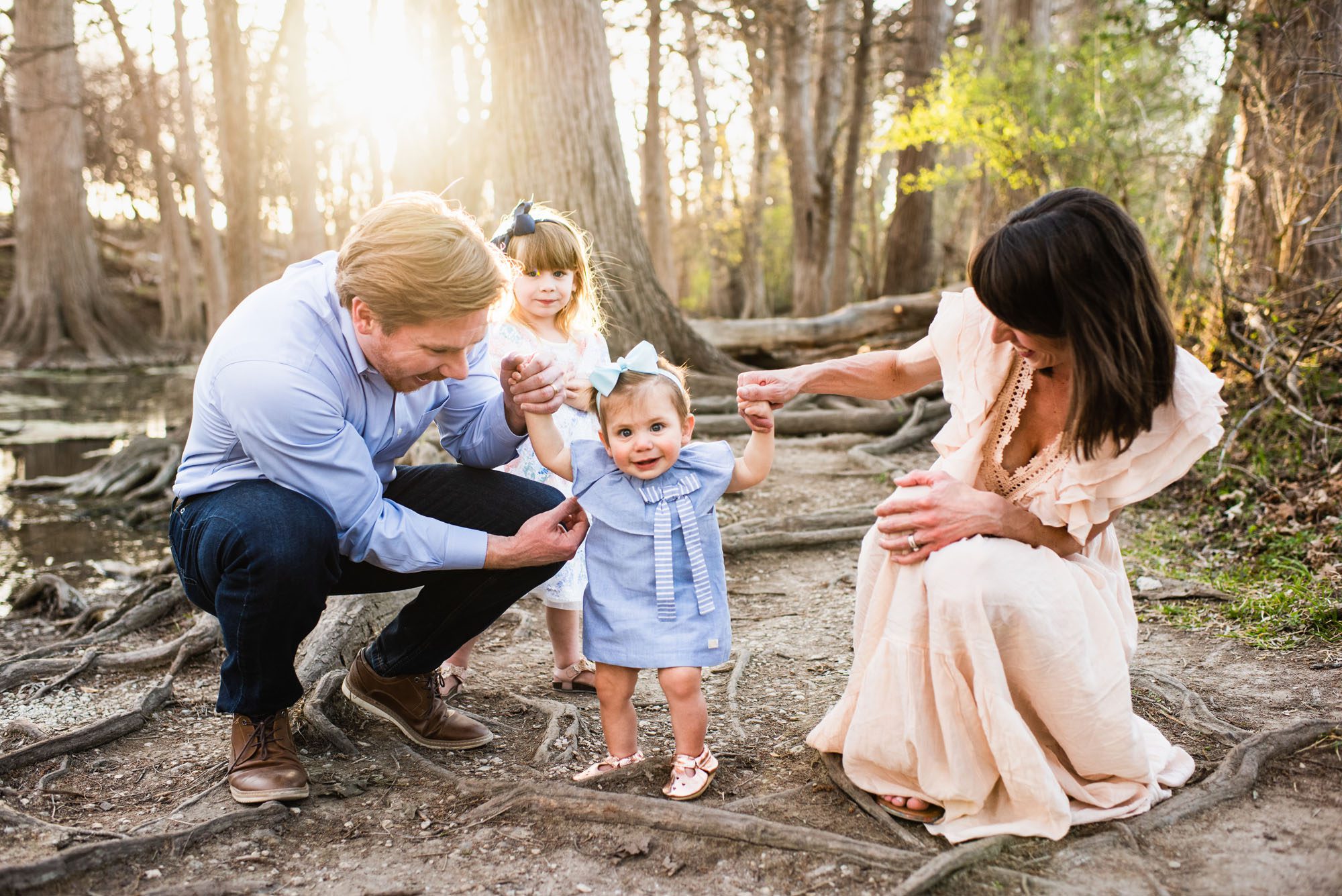 Family playing by the river bank, San Antonio family lifestyle photographer