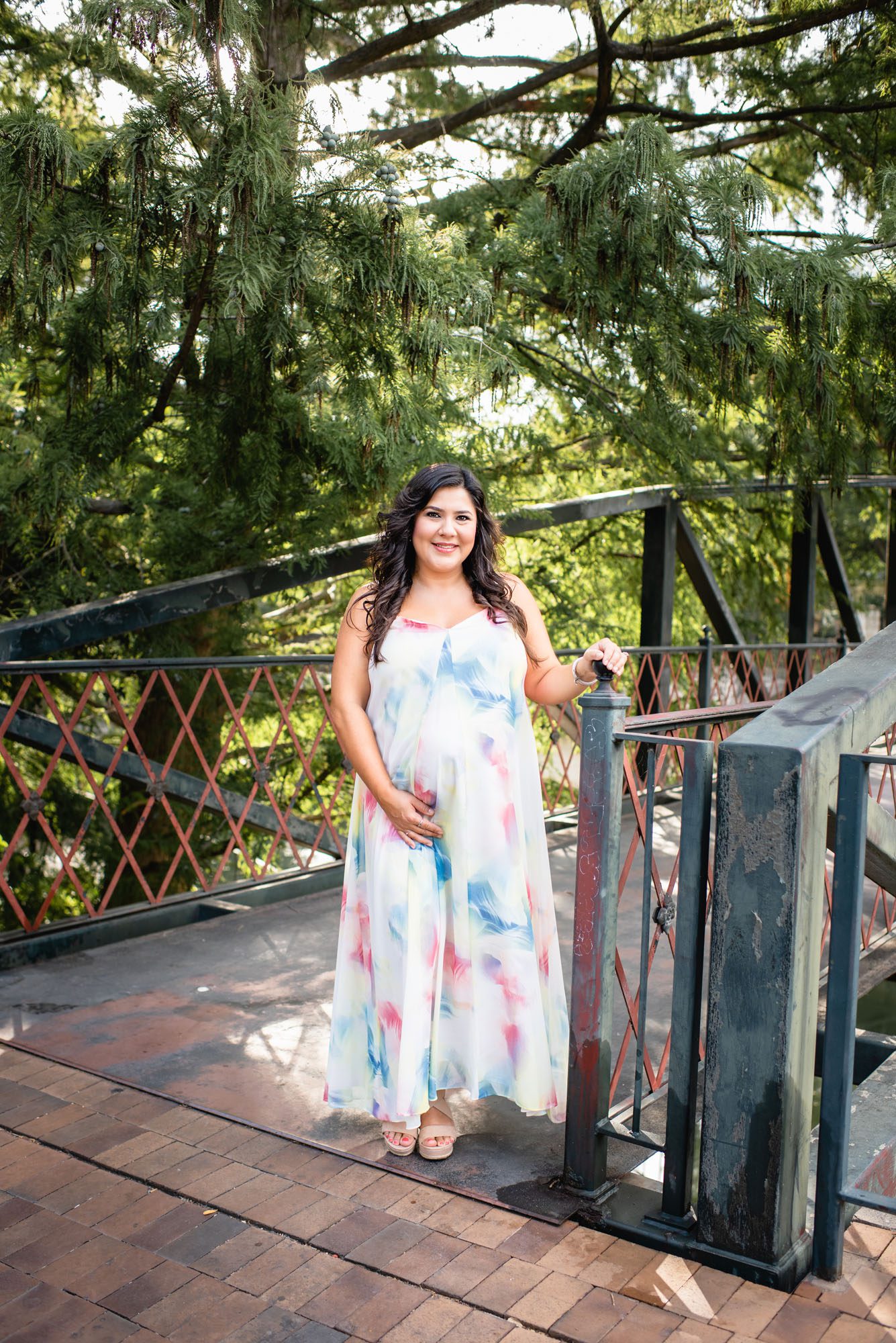 Pregnant mother standing on bridge, San Antonio Maternity Photographer