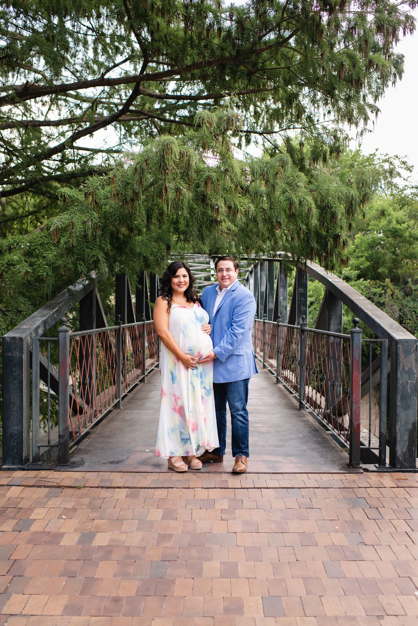 Pregnant couple standing on bridge, San Antonio Maternity Photographer