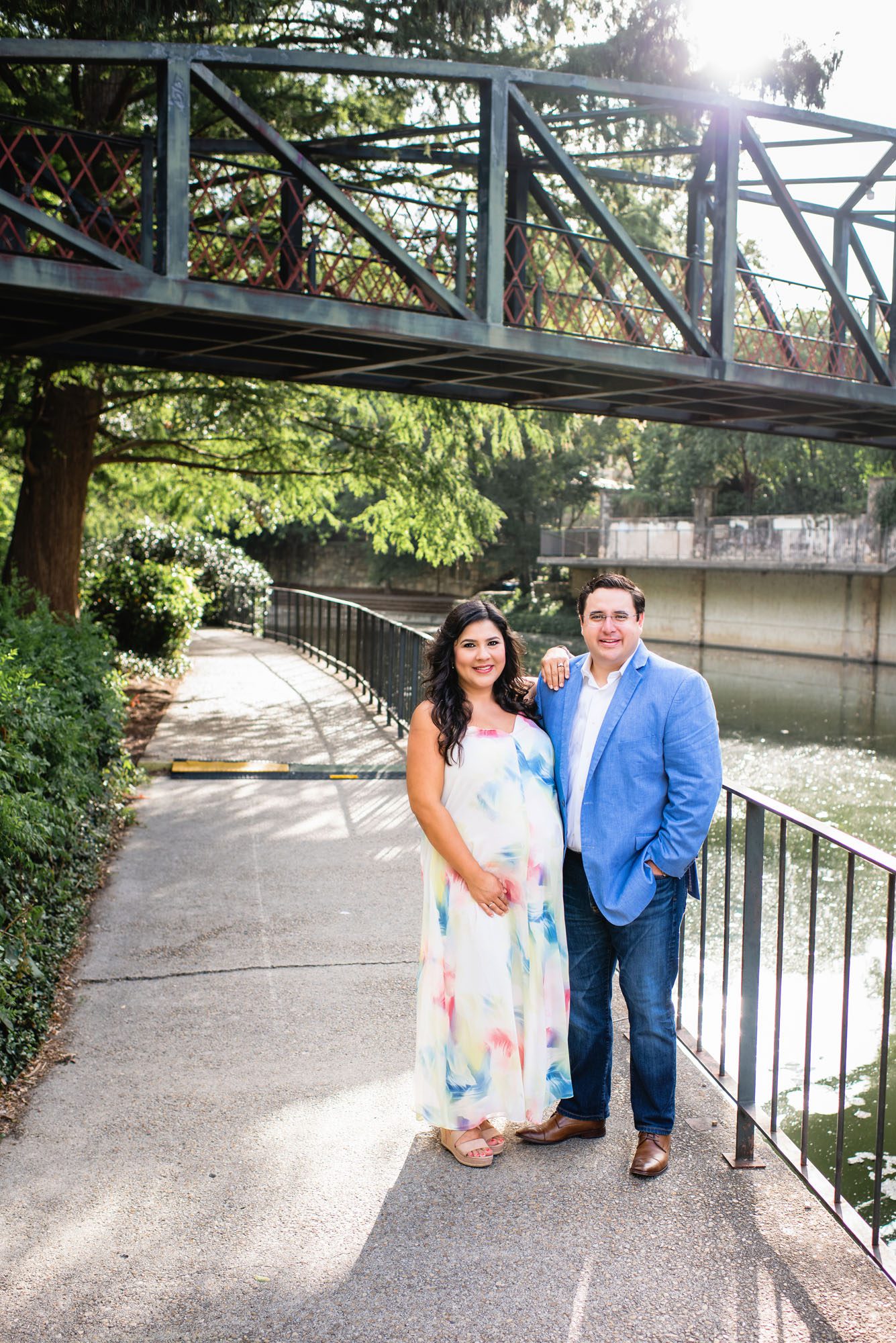 Best San Antonio Maternity Photographer, Pregnant couple standing by river
