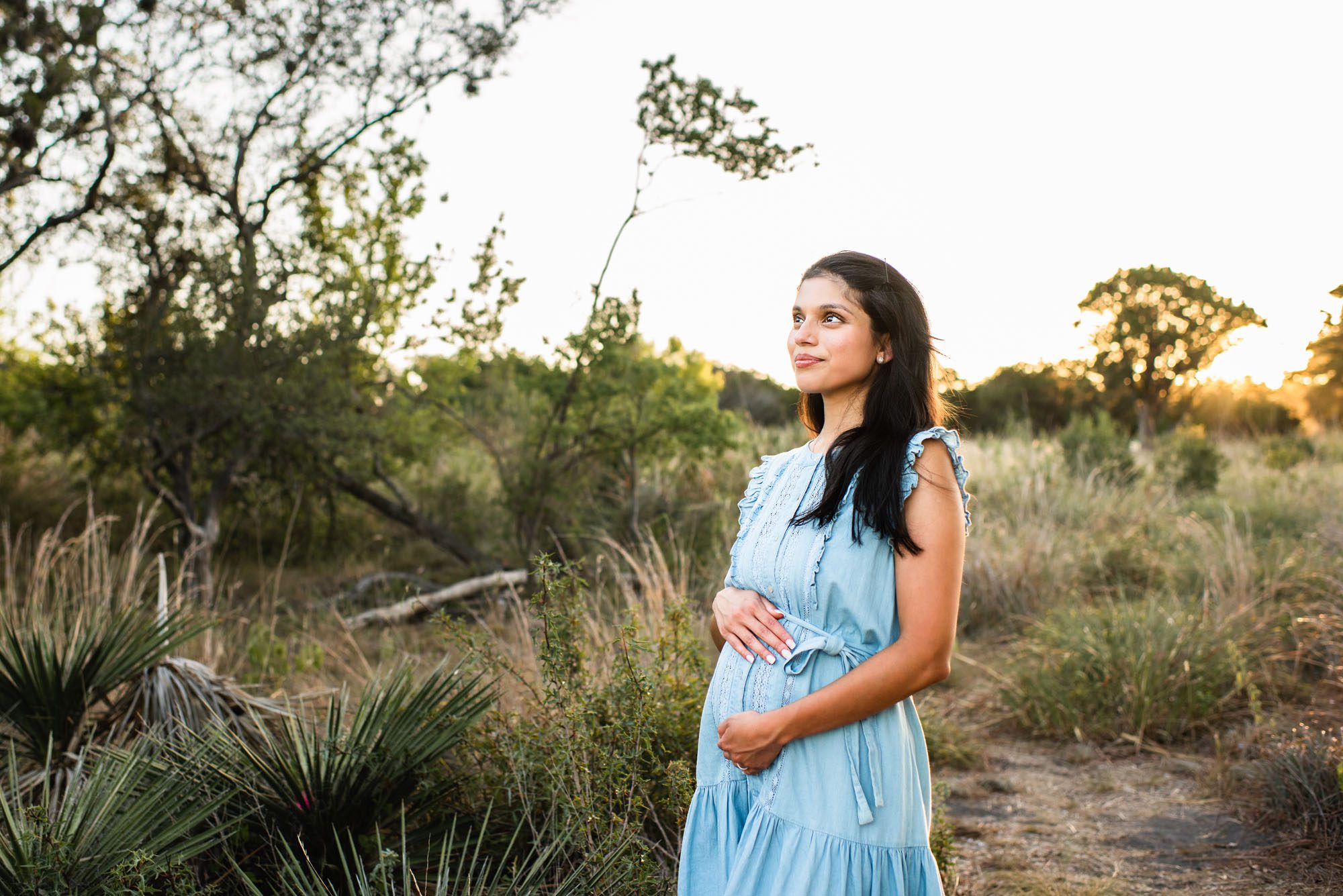 Pregnant mom holding her belly, San Antonio lifestyle photographer