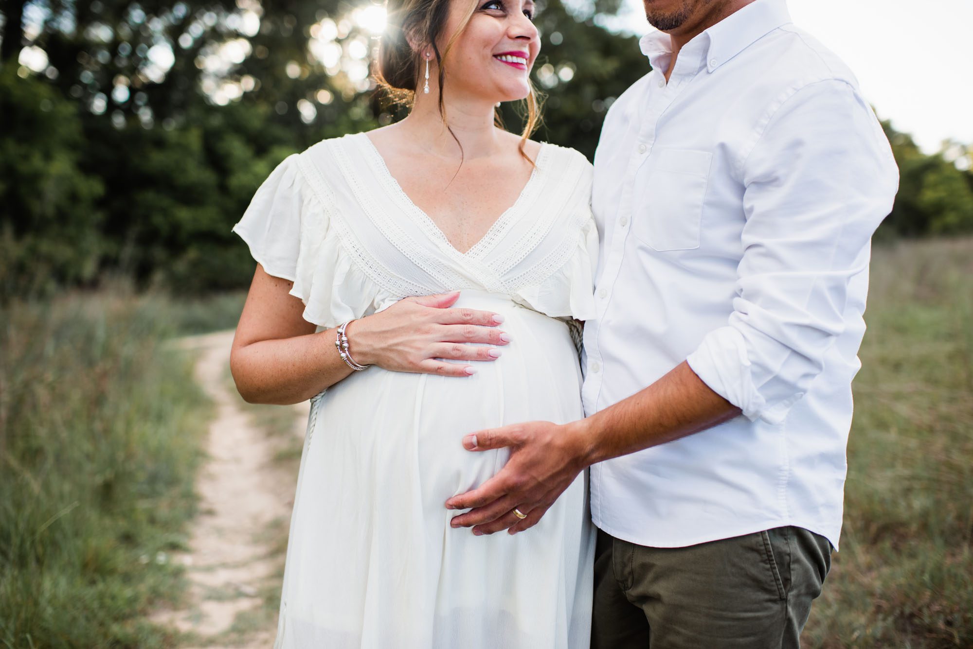 Pregnant mom holding her baby bump, San Antonio maternity photographer