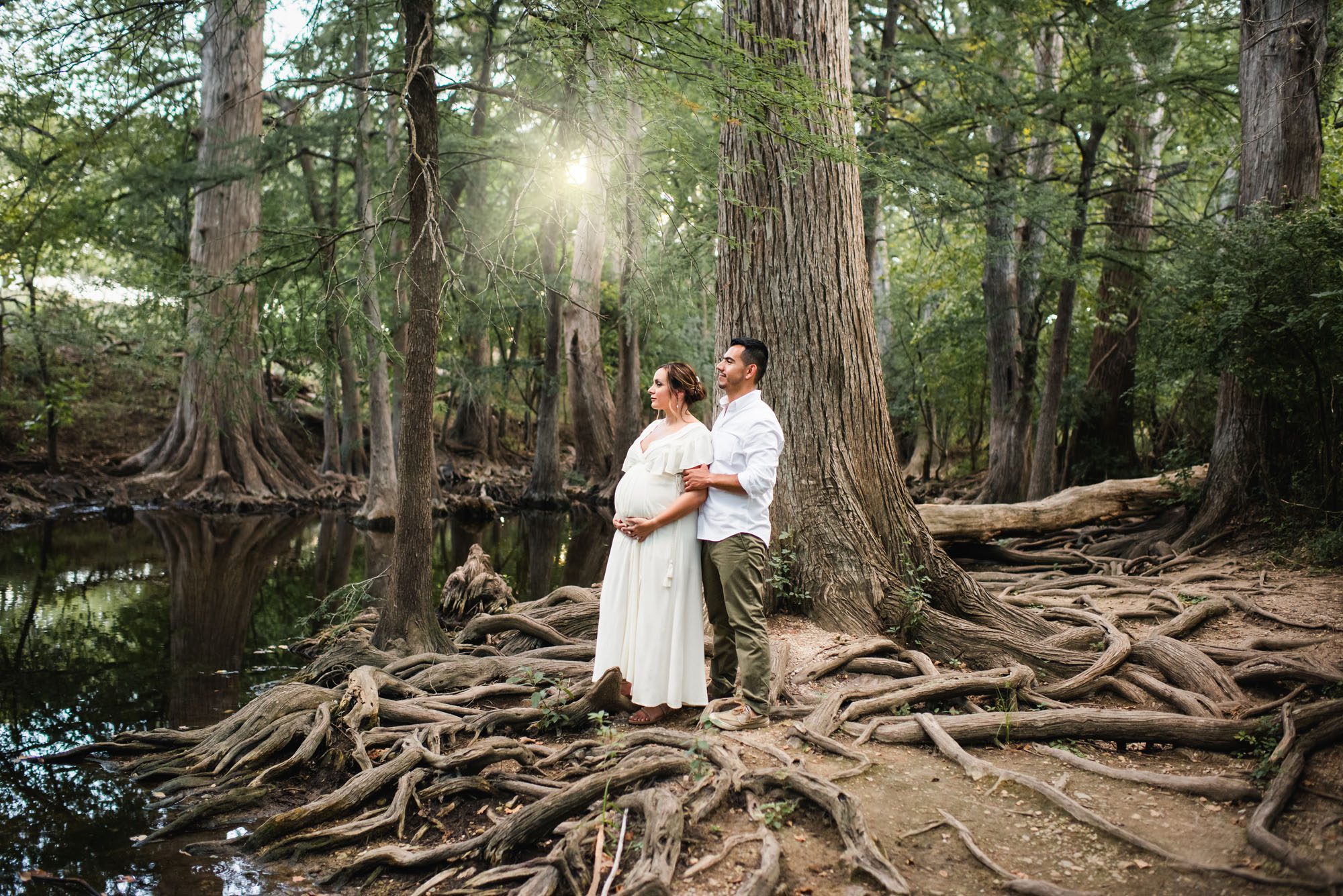 Pregnant standing by creek, San Antonio maternity photographer