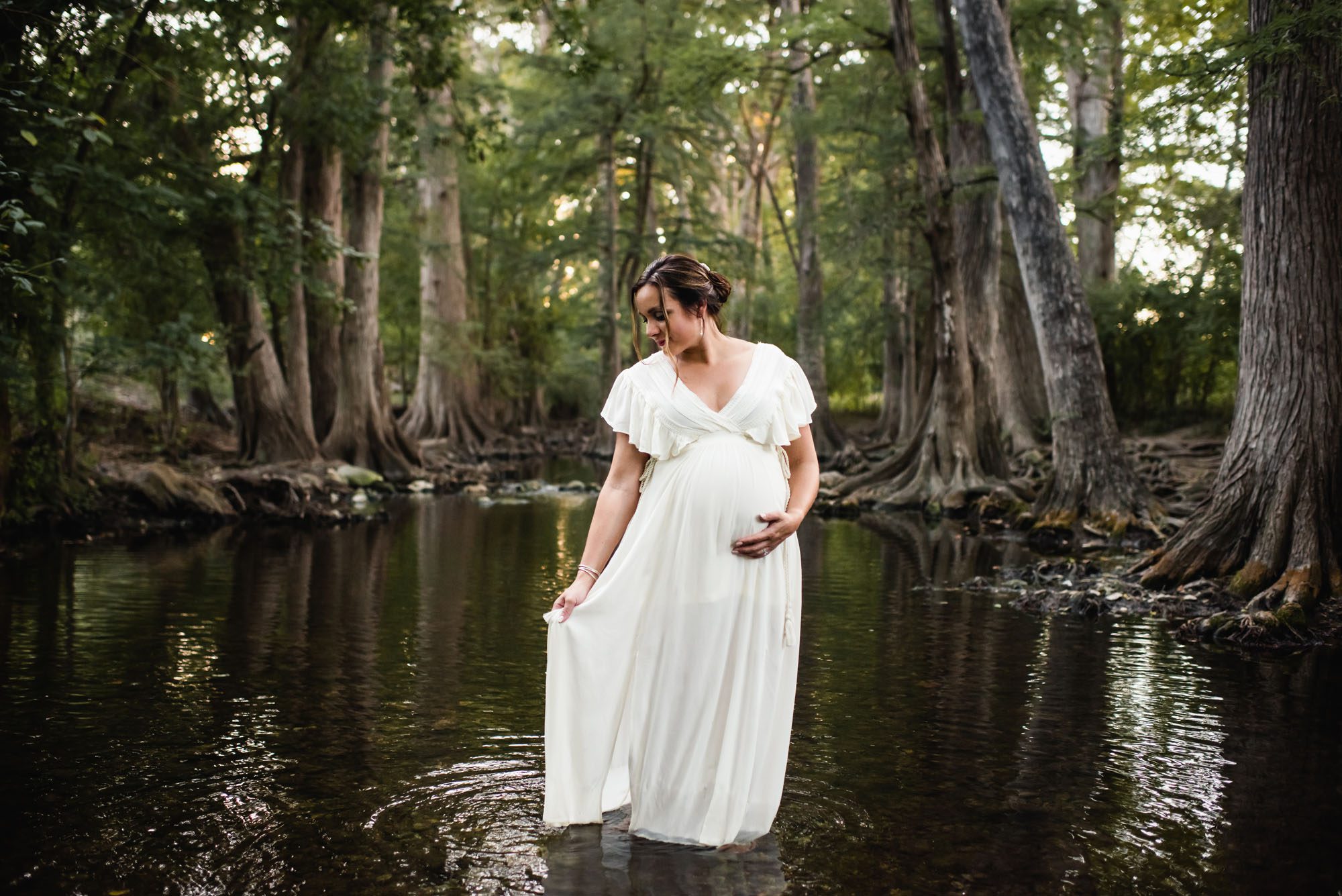 San Antonio Lifestyle Maternity Photographer, pregnant woman standing in creek