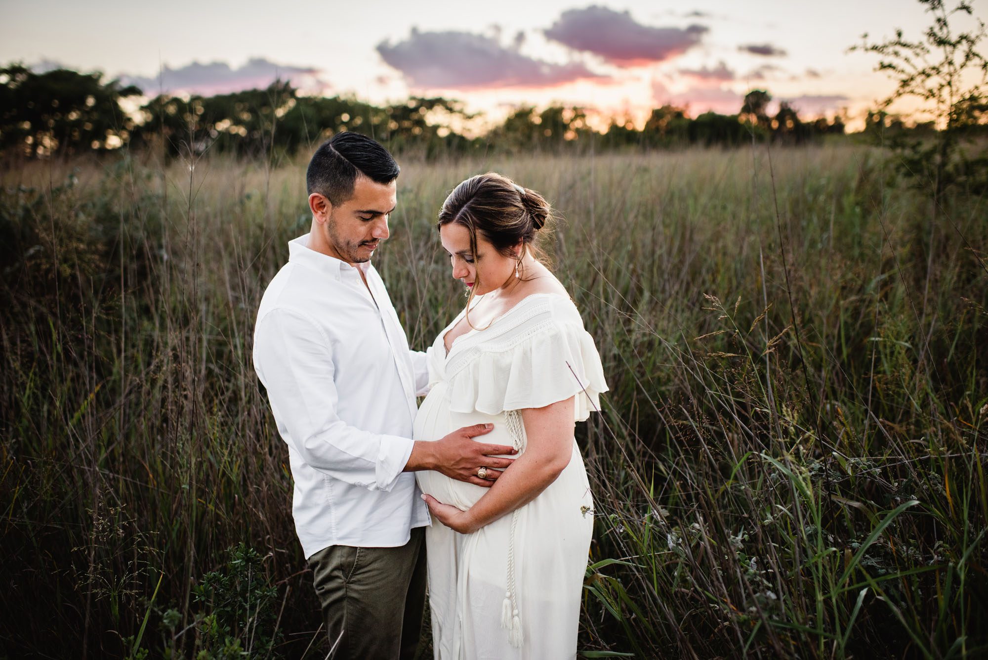 Couple looking at baby bump, San Antonio Maternity Photographer