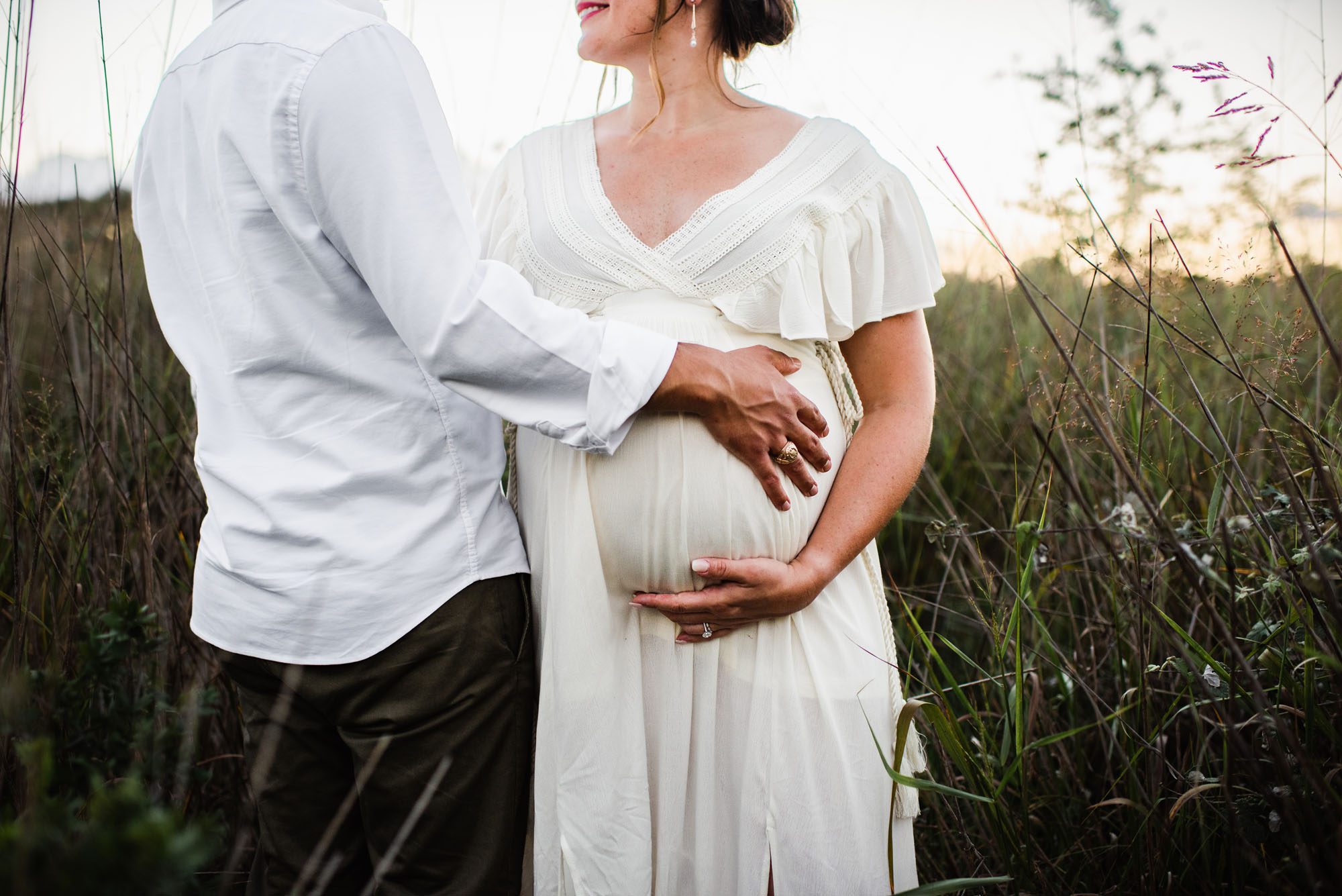 San Antonio Maternity Photographer, couple standing together in the tall grass
