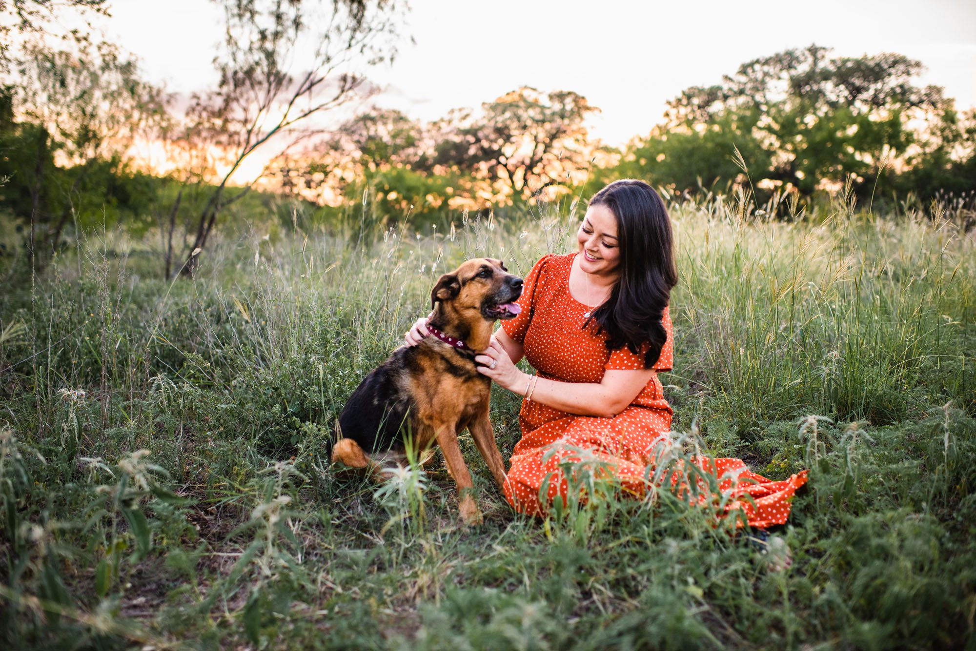 Woman with dog in a field at sunset, San Antonio Lifestyle photographer