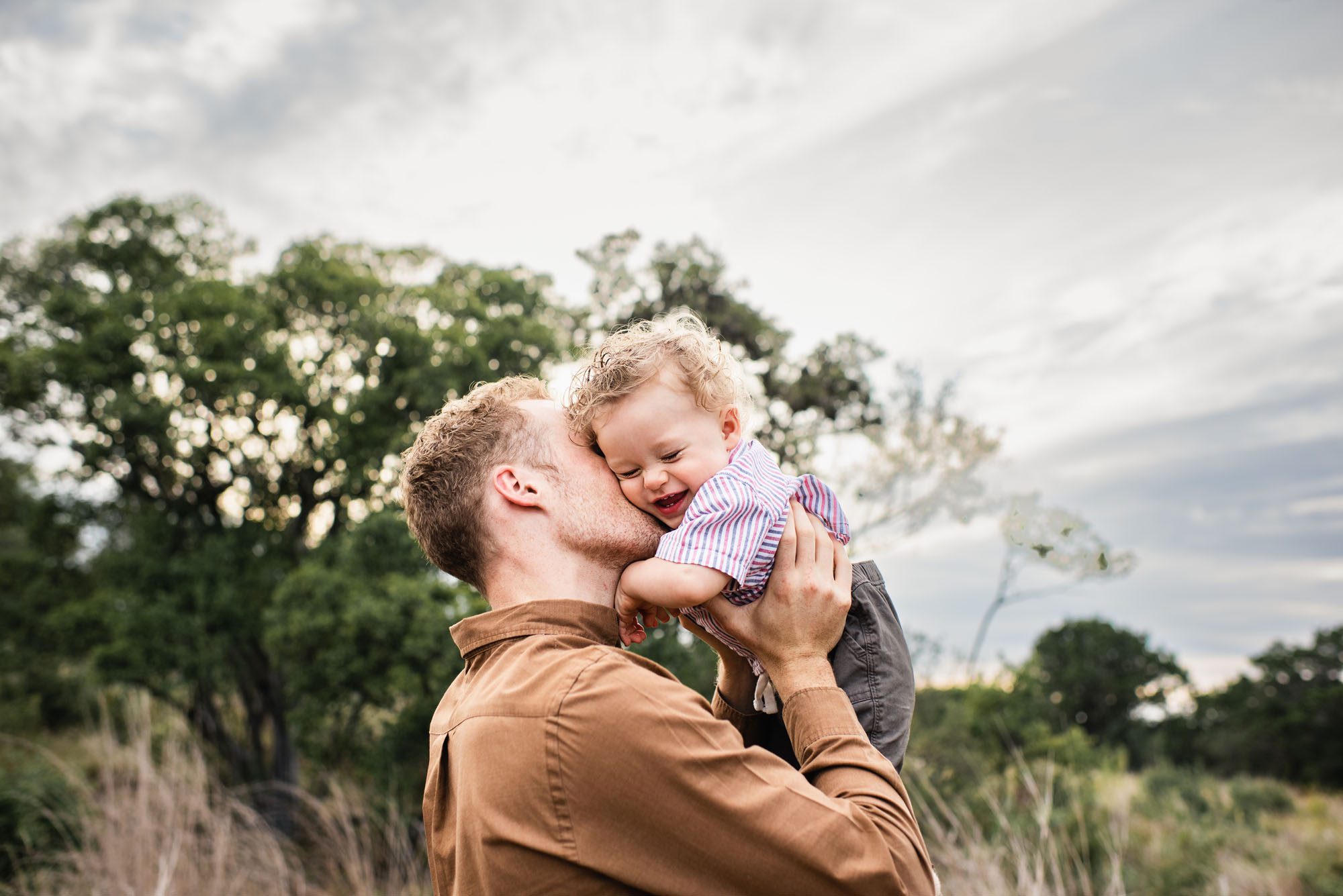 Father kissing baby boy, San Antonio Family Photographer