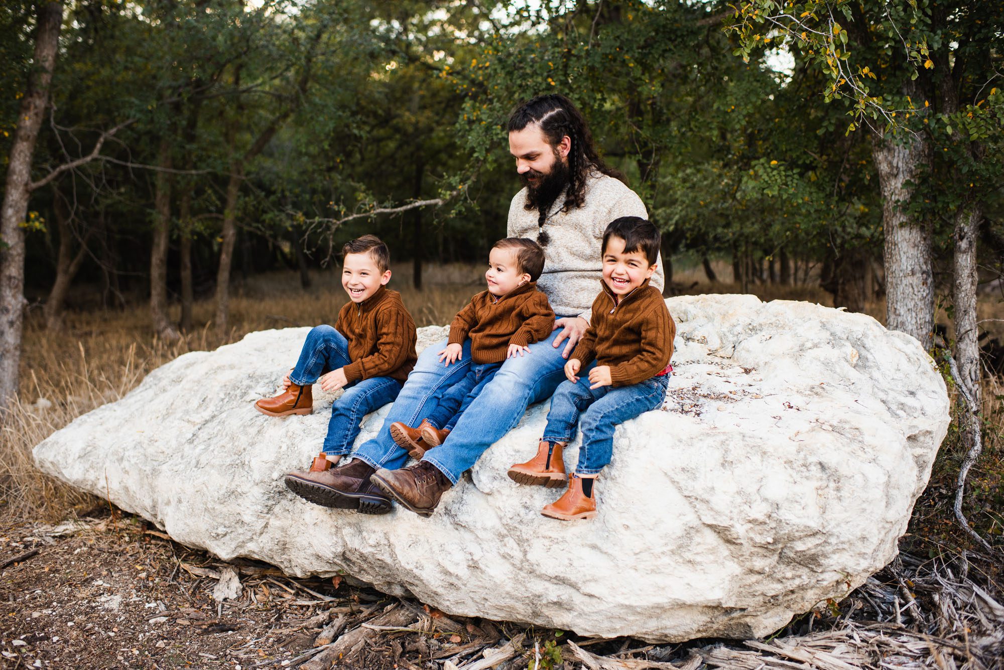 Boys sitting on rock with father, San Antonio Family Lifestyle Photographer