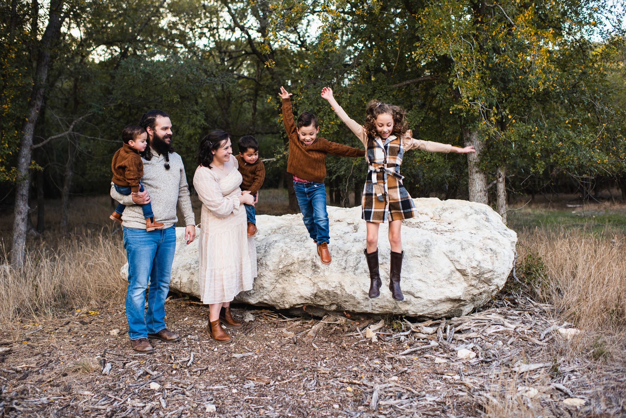 Kids jumping off a big rock, San Antonio Family Lifestyle Photographer