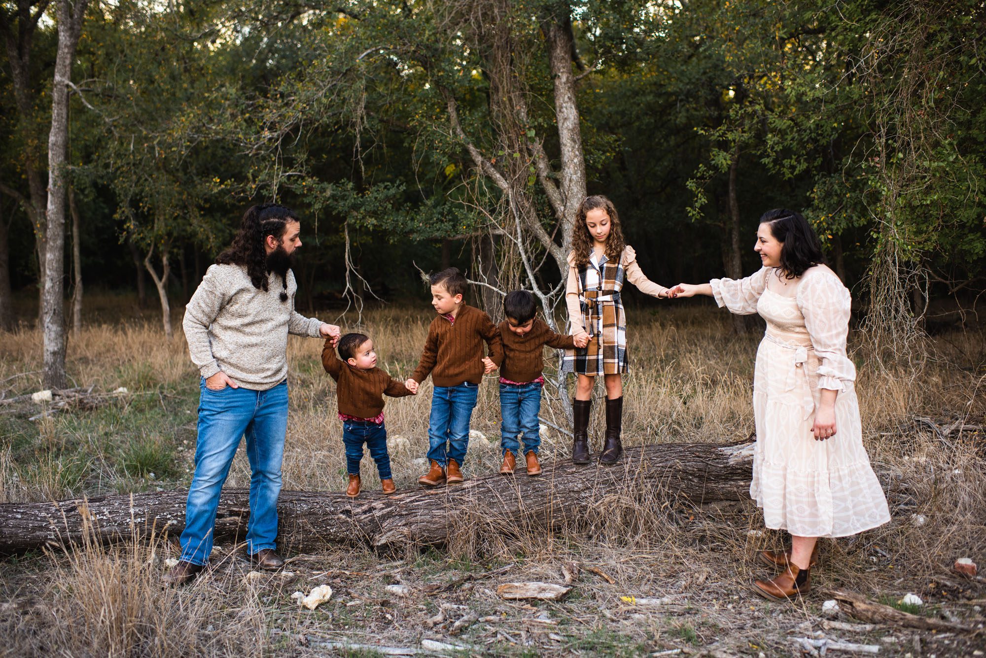 Kids standing on a log with parents, San Antonio Family Photographer