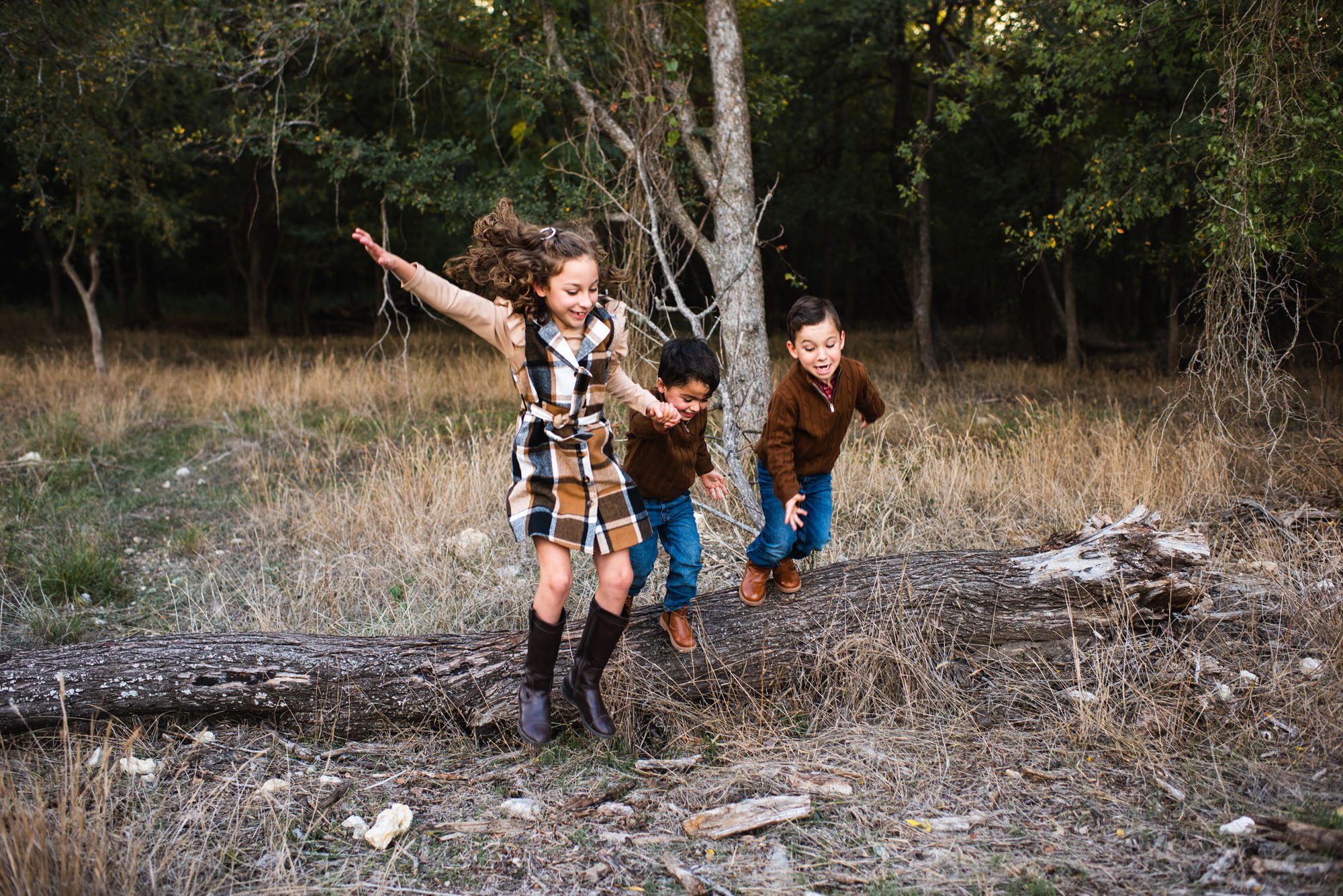 Kids jumping off a log, San Antonio Lifestyle Photographer