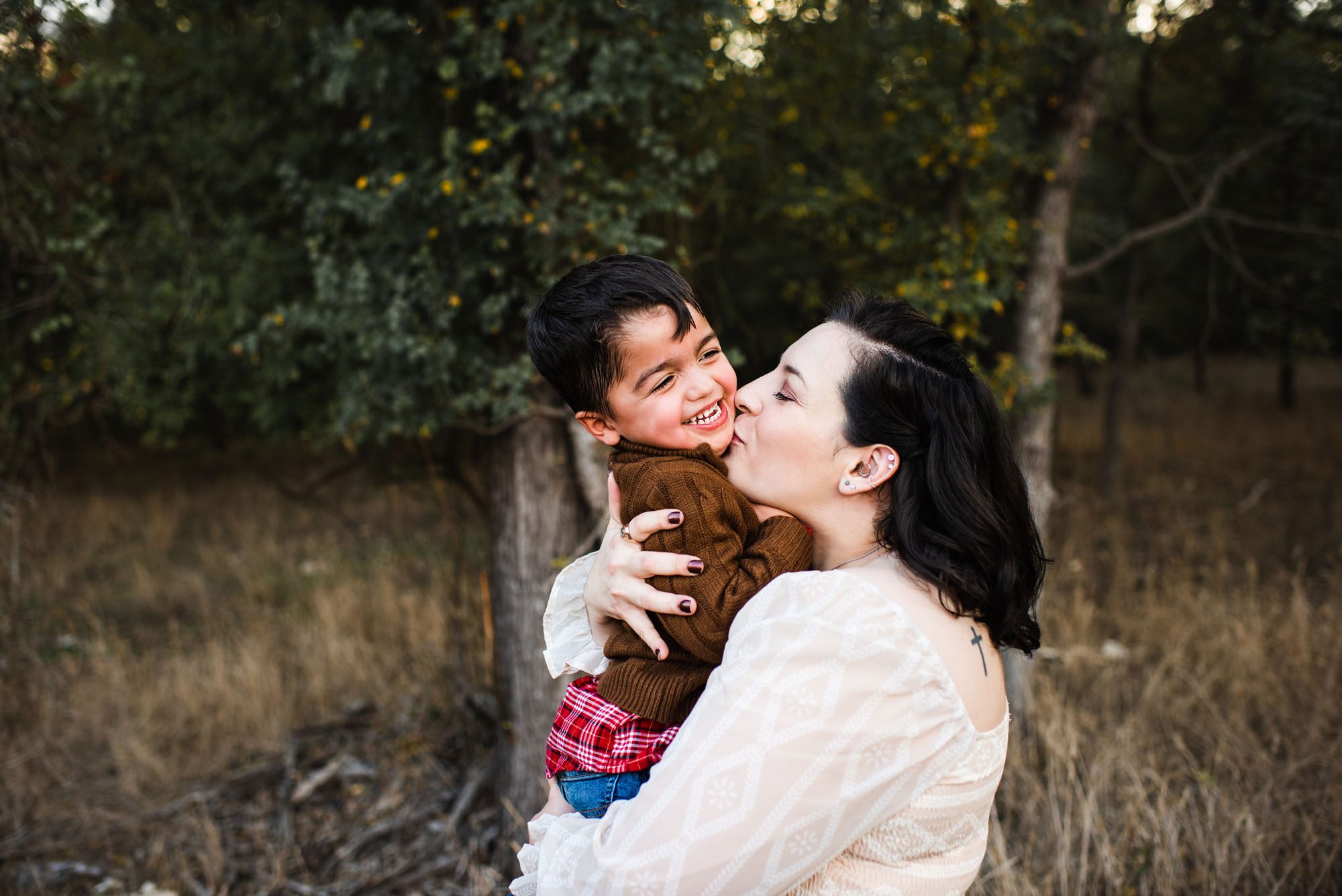 Mother kissing son, San Antonio Lifestyle Family Photographer