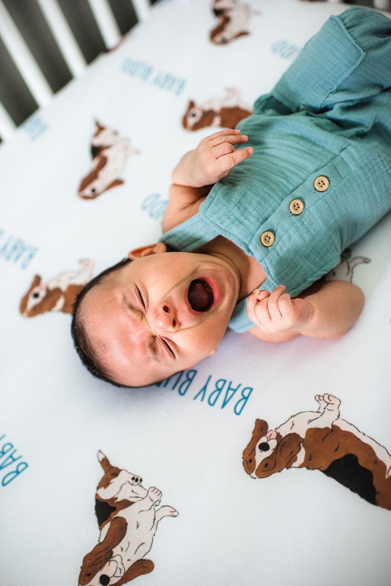 Newborn baby yawning in crib, San Antonio lifestyle newborn photographer