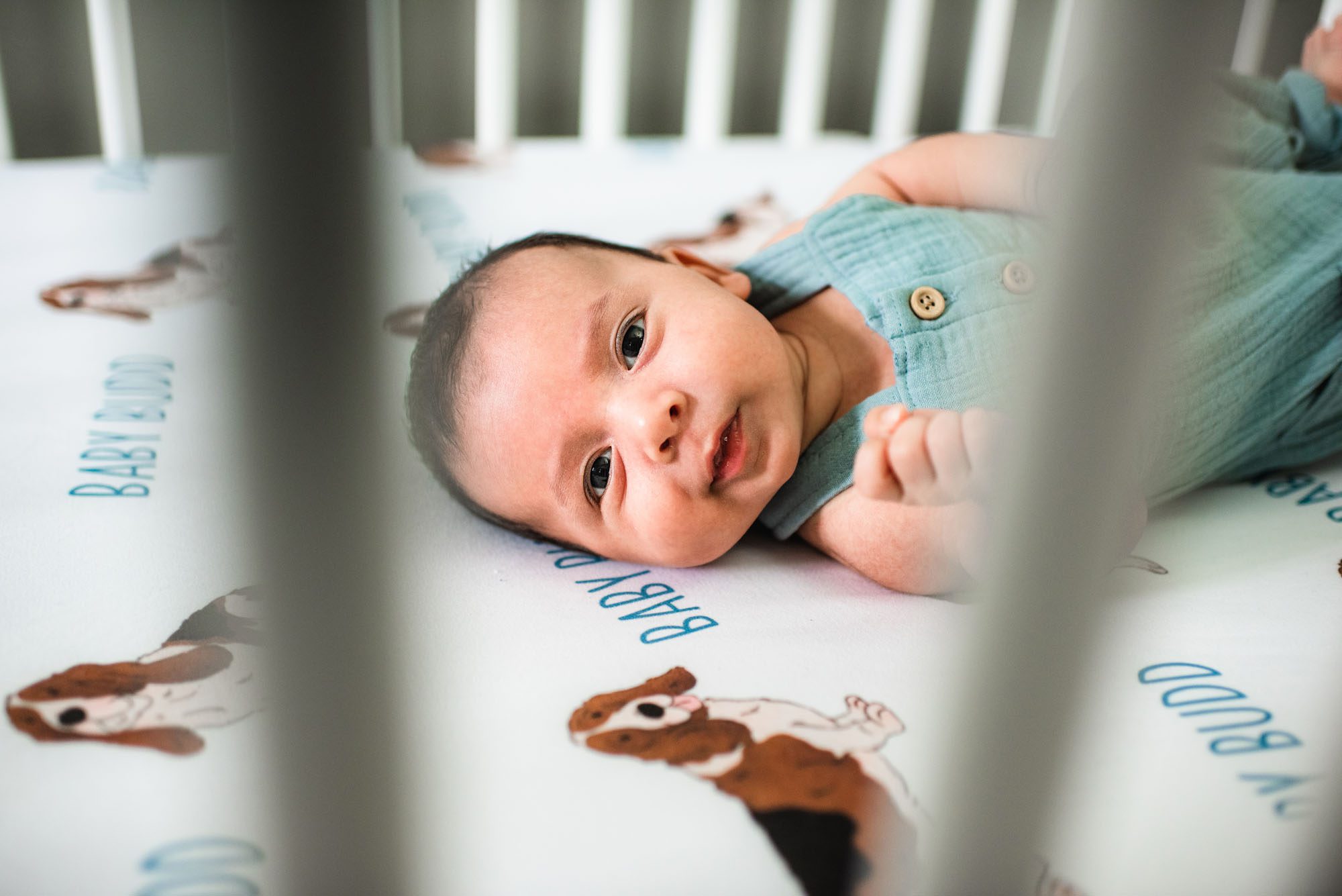 Newborn baby in crib, San Antonio lifestyle newborn photographer