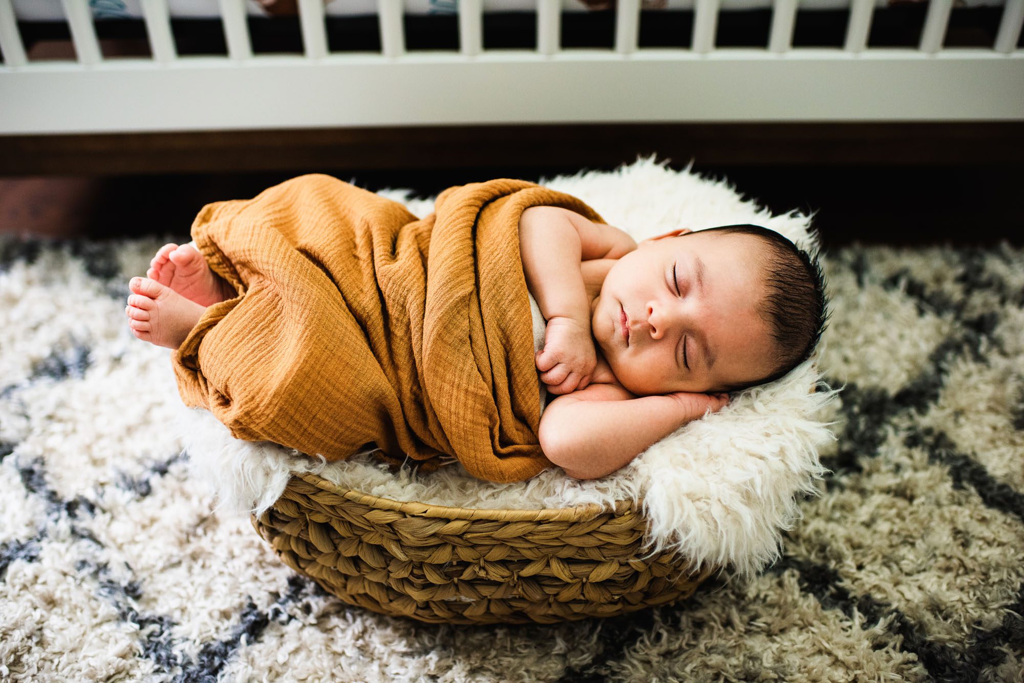 Sleeping newborn boy in basket, San Antonio newborn photographer