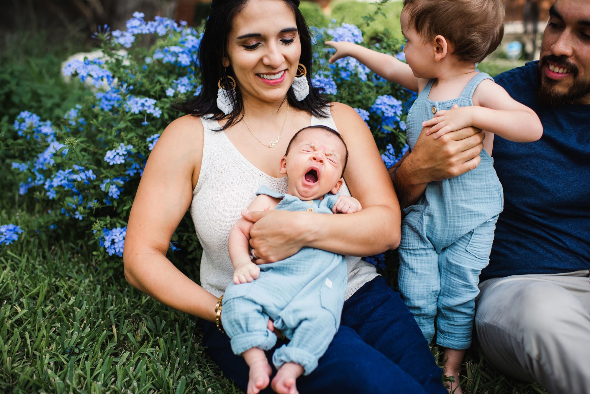 San Antonio Newborn Photographer, Baby yawning on mother's lap