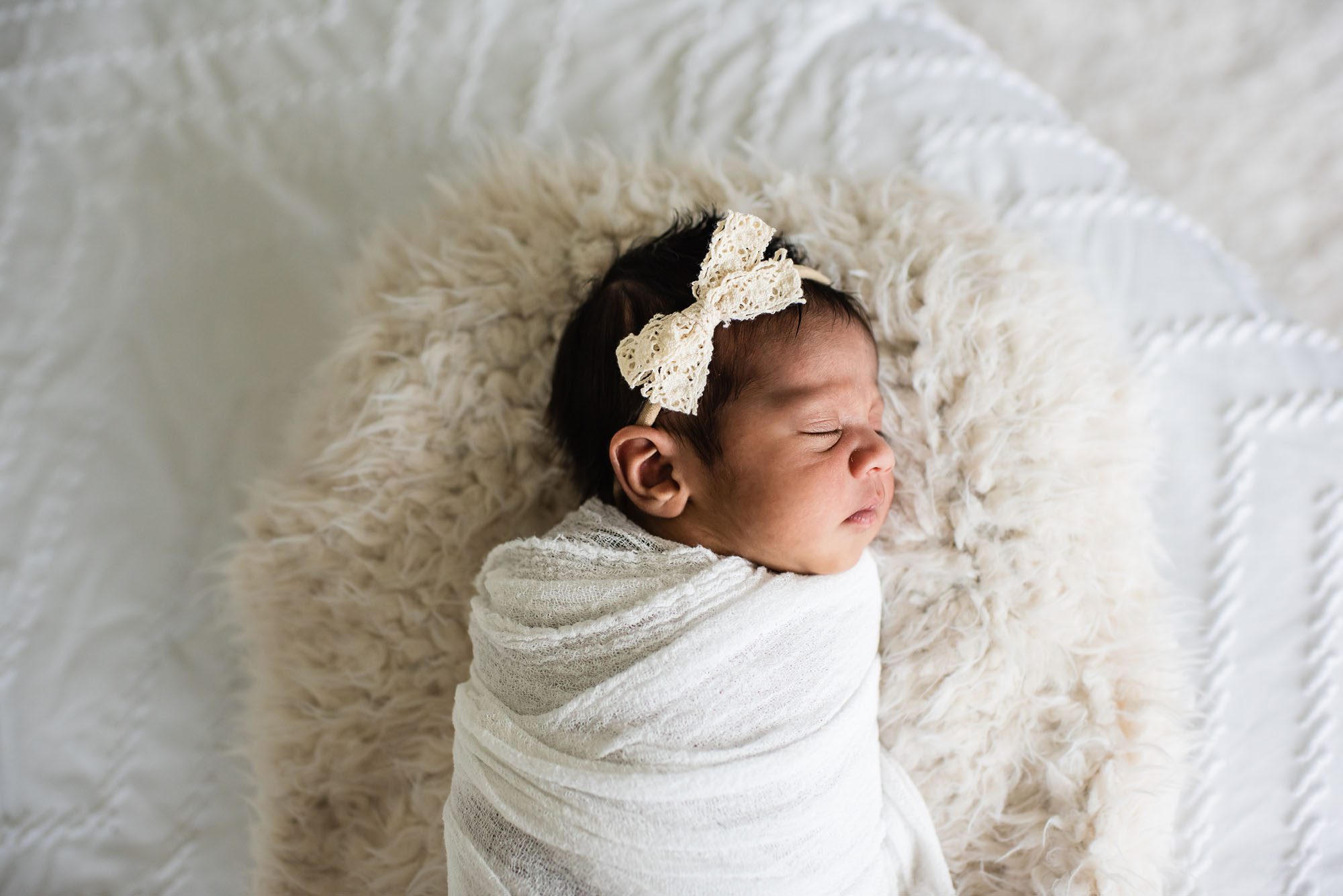 Newborn baby asleep in basket with headband, San Antonio Newborn Photographer