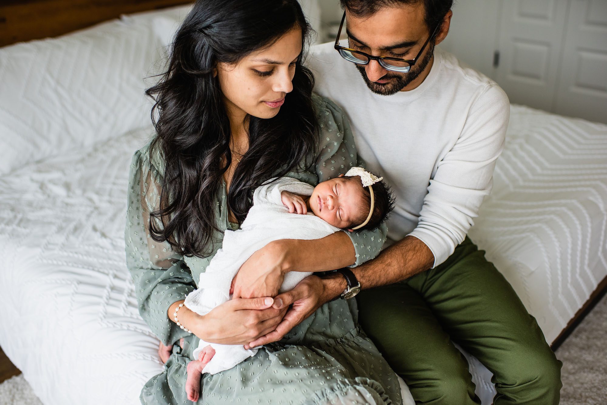 San Antonio Newborn Photographer, Couple looking at newborn daughter