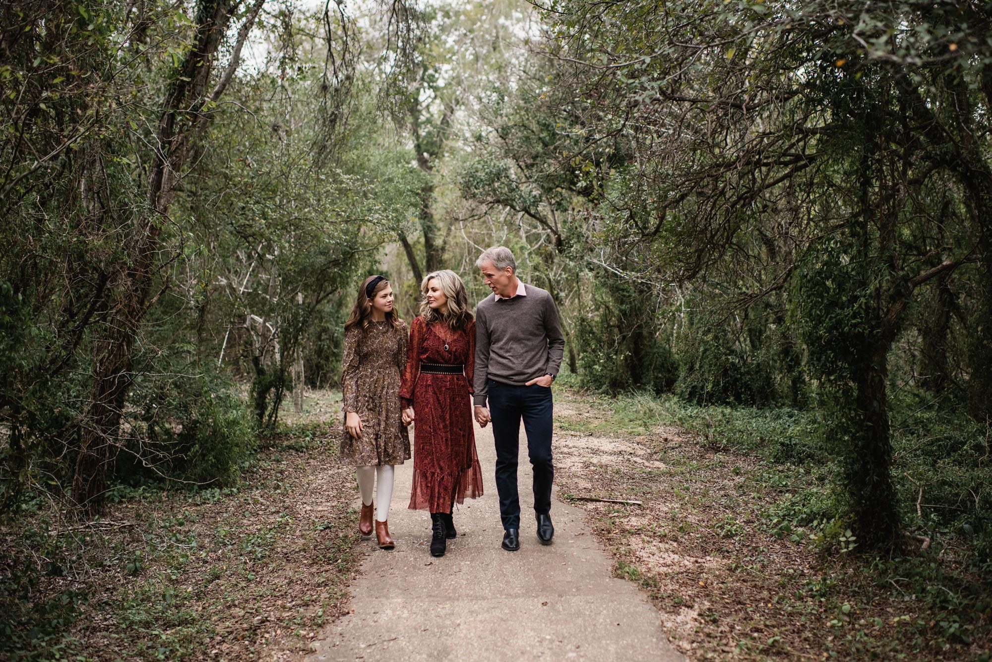 Family walking along trail in the woods, San Antonio lifestyle photographer