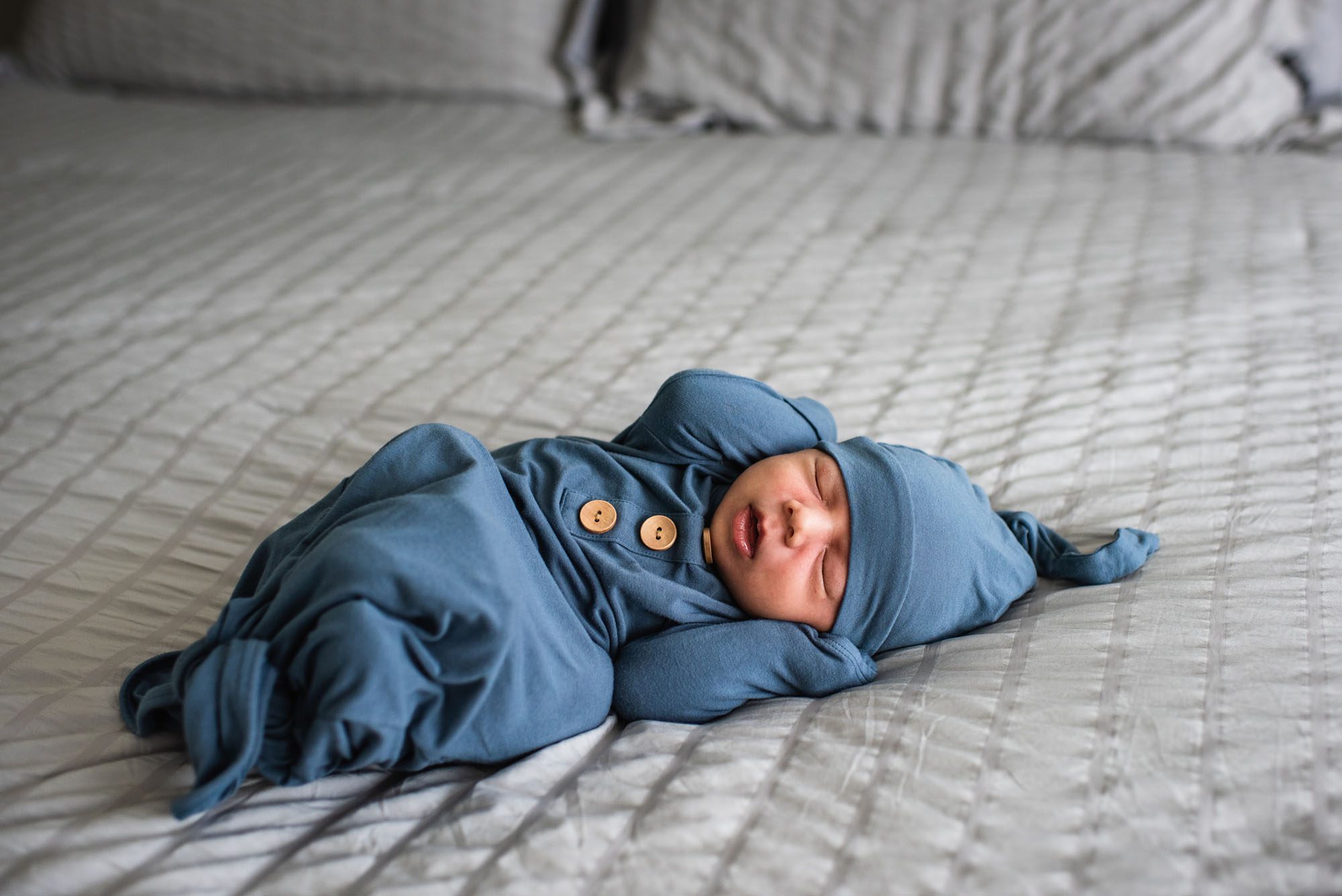 San Antonio Newborn Photographer, newborn baby laying on bed