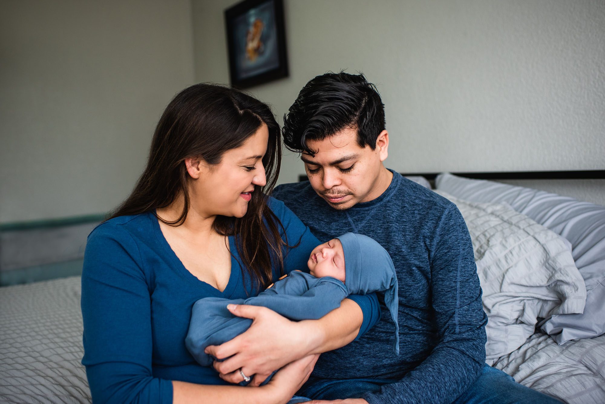 Couple smiling at baby, San Antonio Newborn Photographer