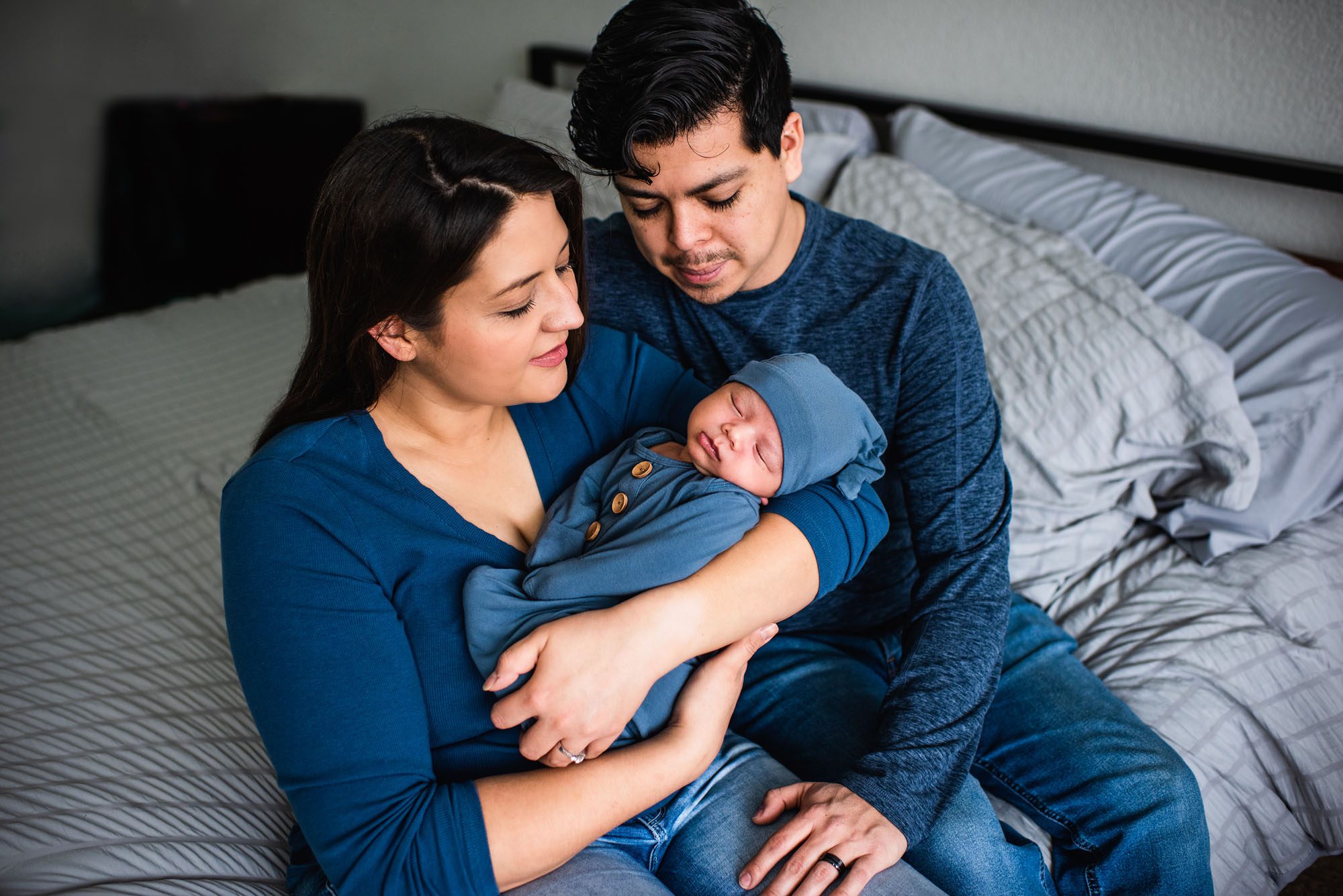 San Antonio Newborn Photographer, Couple smiling at newborn baby