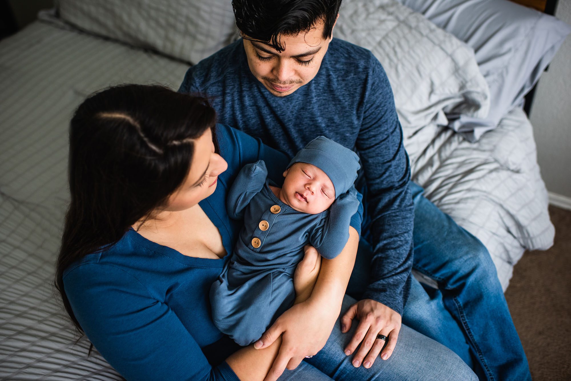 San Antonio Newborn Photographer, Couple looking at newborn baby