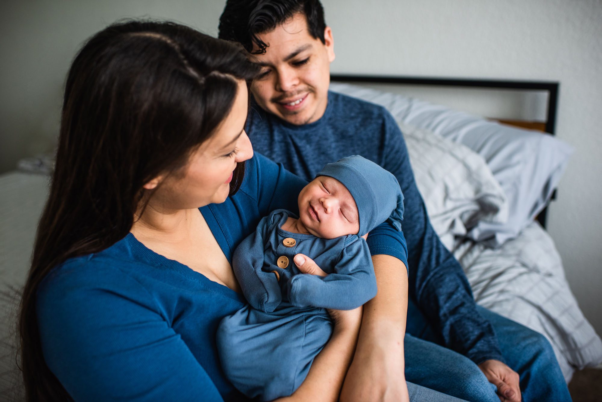 San Antonio Newborn Photographer, Couple looking at smiling newborn baby