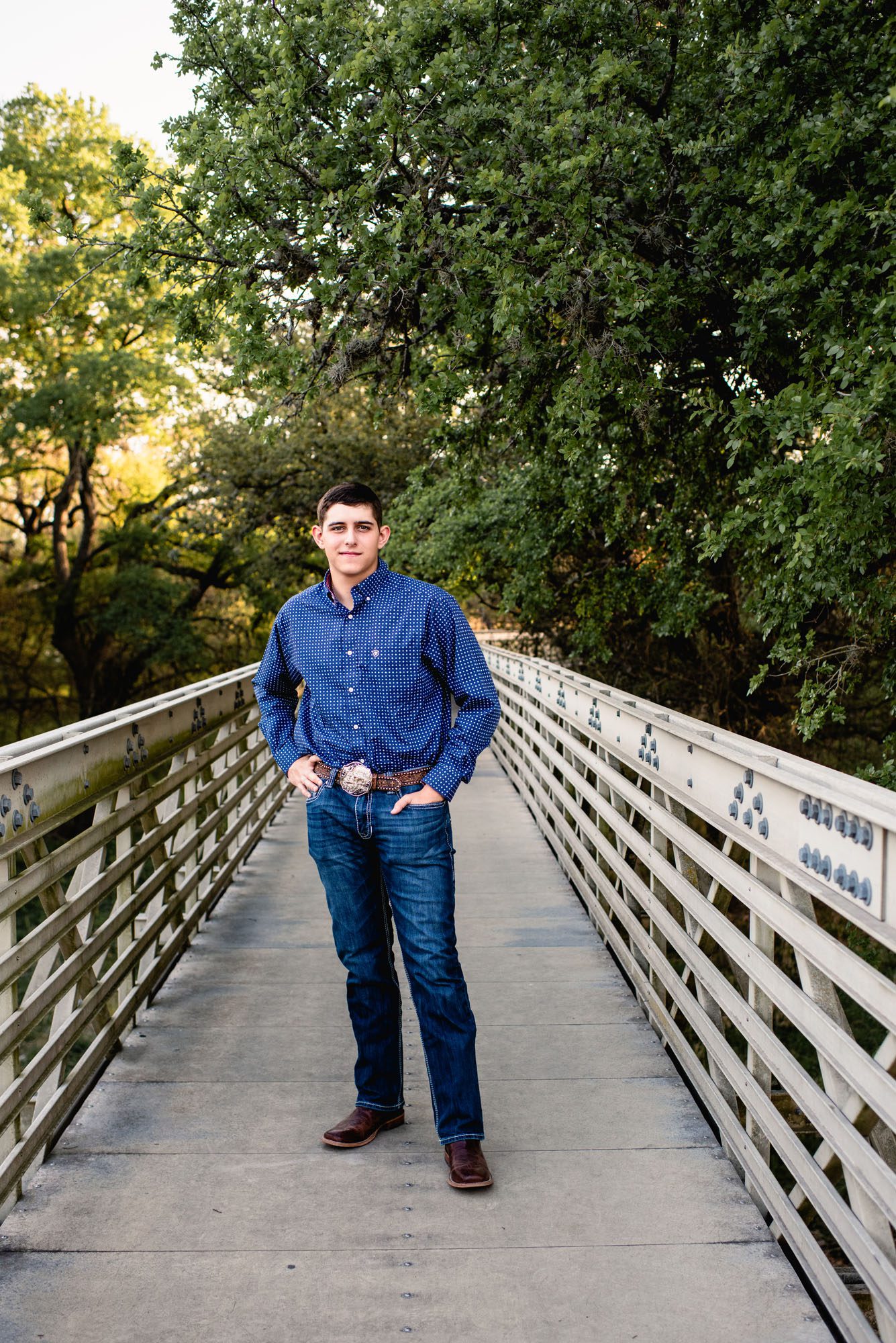 Boy standing on a bridge, San Antonio senior portrait photographer