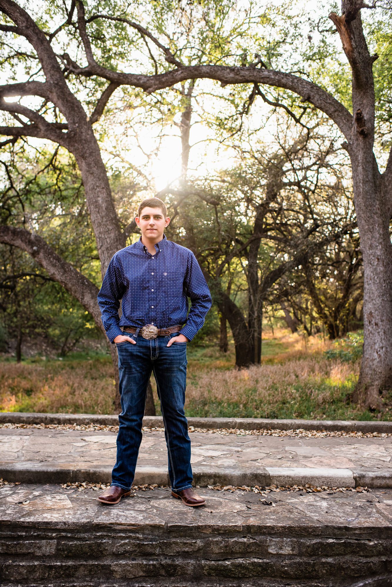 Boy standing in the woods, San Antonio senior photographer