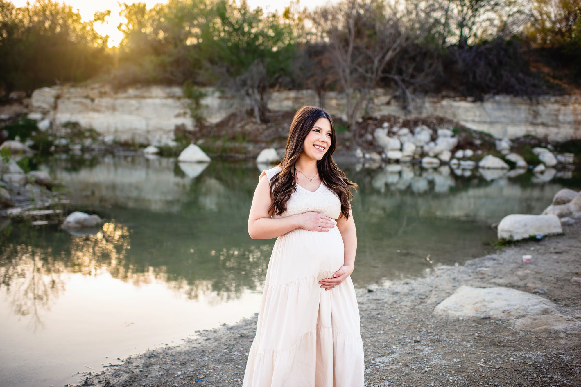 Pregnant mom by a lake at sunset, San Antonio maternity photographer