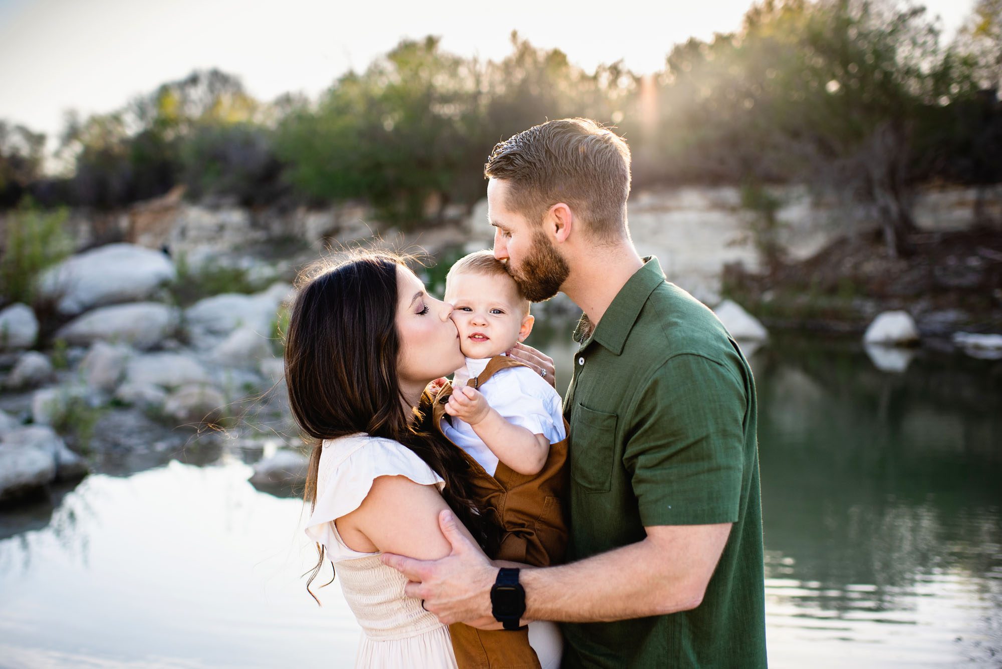 Parents kissing son on the cheeks, San Antonio family photographer