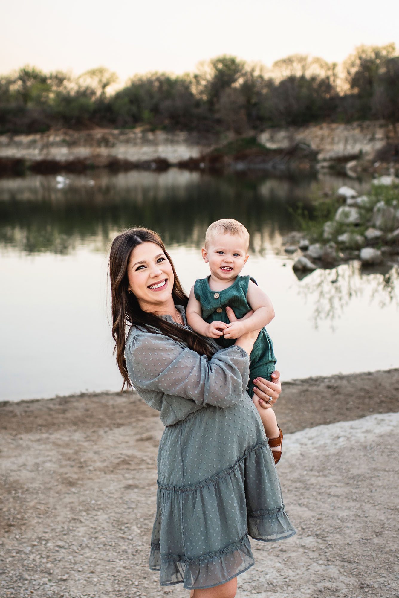 Mother and son smiling by a lake, San Antonio maternity photographer