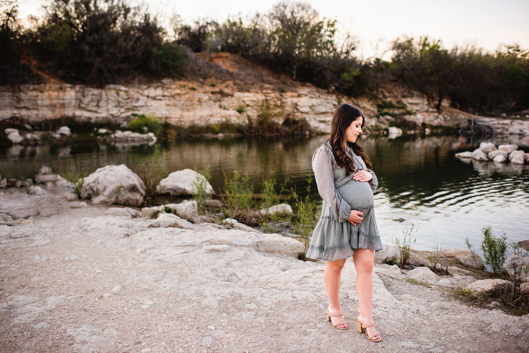 Expectant mother walking by a pond, San Antonio maternity photographer