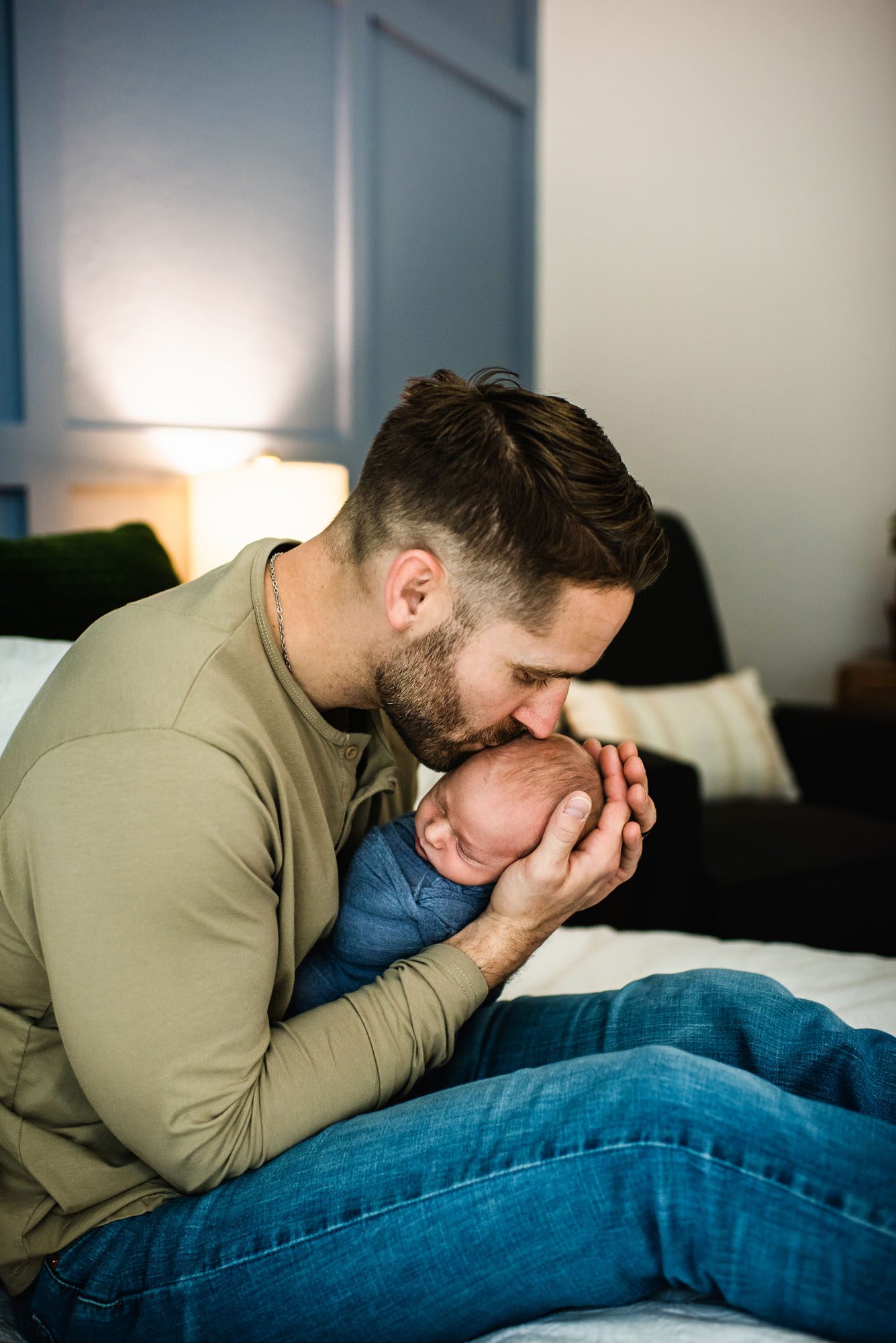 Dad kissing newborn son's head, San Antonio lifestyle newborn photographer